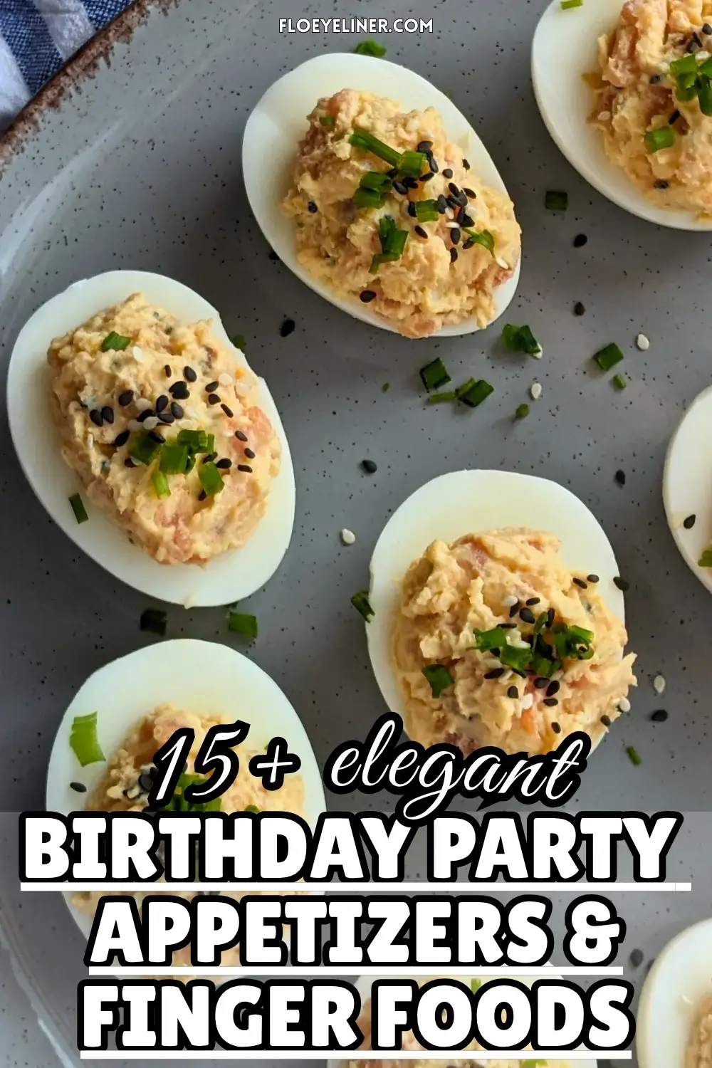 Smoked Salmon Deviled Eggs - deviled eggs filled with a creamy smoked salmon, cream cheese, sour cream, dijon mustard, and crispy dried chopped onions filling, topped with toasted sesame seeds and chopped chives.