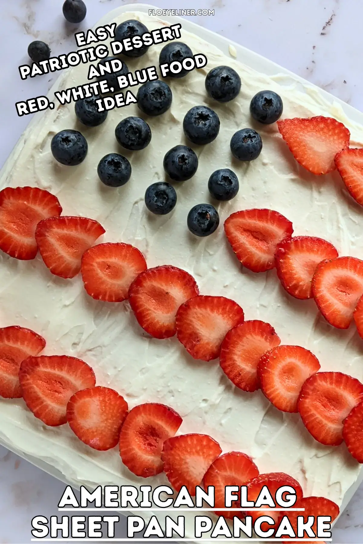 American Flag Sheet Pan Pancake - large sheet pan pancake decorated with a sweet ricotta frosting with strawberries for stripes and blueberries for stars, resembling the American flag.