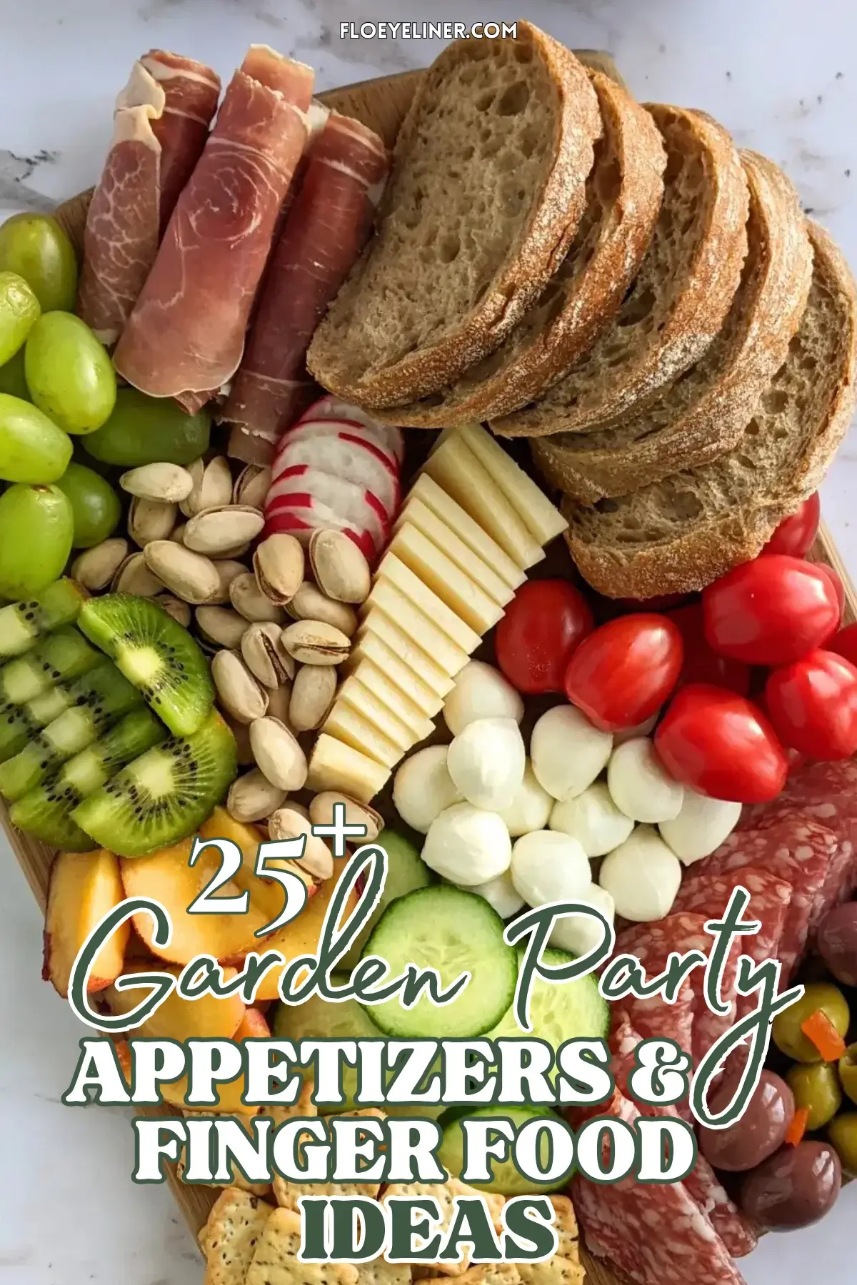 Colorful Antipasto Party Food Platter - A vibrant colorful antipasto party food platter with cured meats, marinated veggies, cheeses, olives, fruit, and ciabatta arranged on a wooden platter.