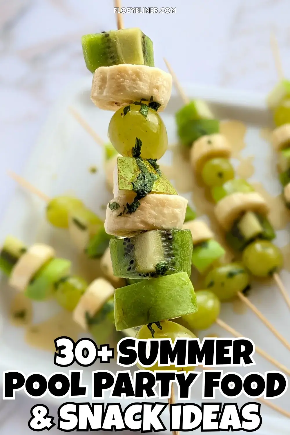 Green Fruit Kabobs - fruit skewers made with chunks of green fruits like kiwi, grapes, green apple, and green pear, plus chunks of bananas, drizzled with a fresh mint, lime juice, and maple sryup sauce.