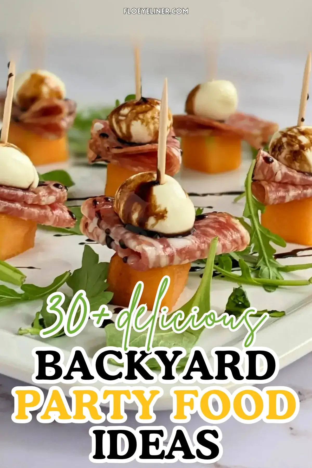 Melon and Salami Toothpick Appetizers With Mozzarella - easy fruit and cheese skewers made with melon, dried salami, and mini mozzarella balls served on a bed of arugula and topped with a balsamic glaze.