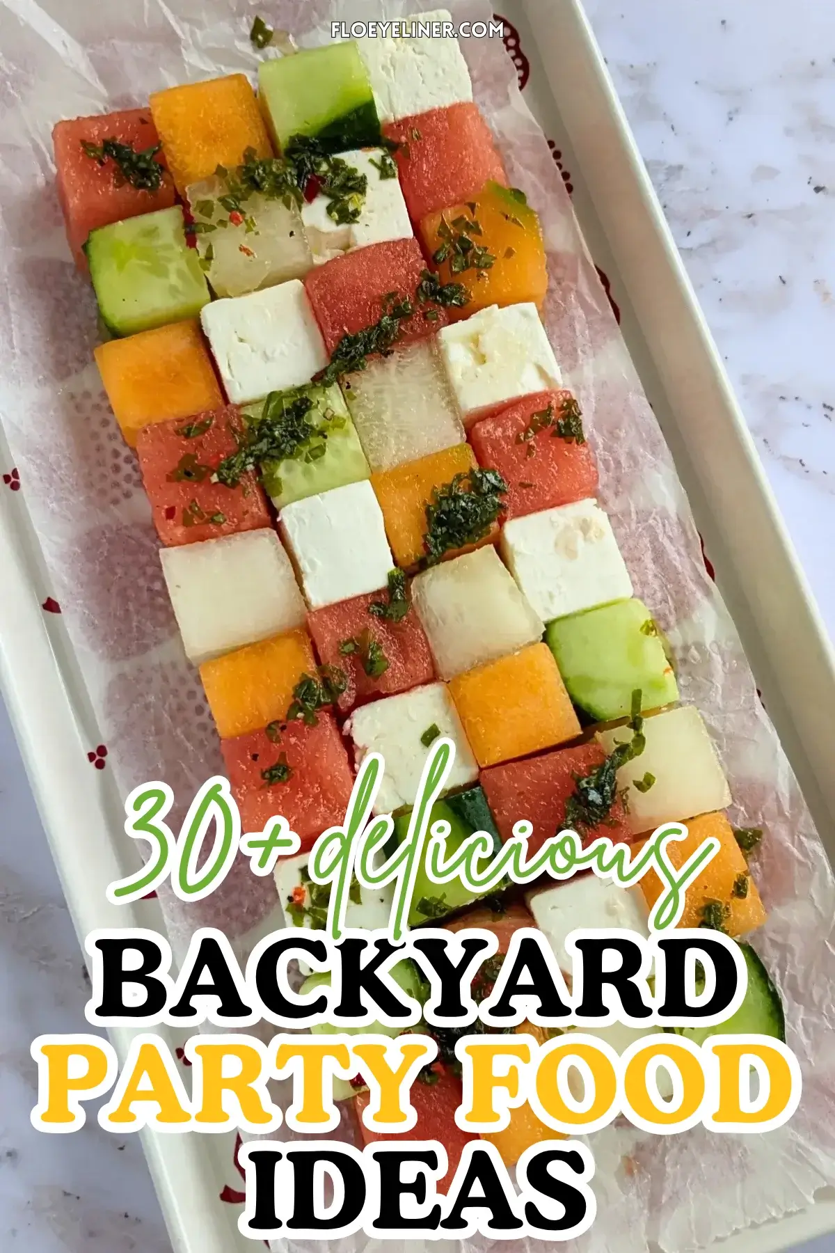 Melon Cucumber Watermelon and Feta Tetris Salad Appetizer Bites - easy fruit and cheese appetizer board with cubed melon, cucumber, watermelon and feta arranged as a grid and Tetris salad with a drizzle of spicy mint vinaigrette.