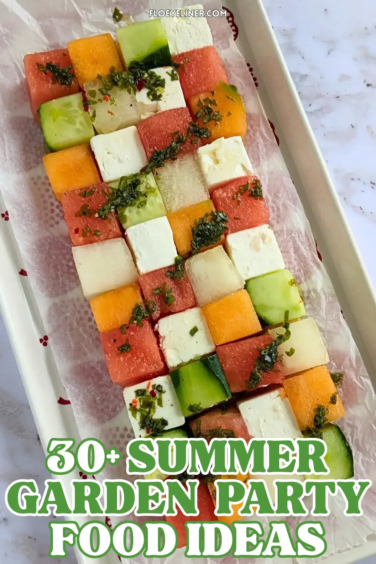 Melon Cucumber Watermelon and Feta Tetris Salad Appetizer Bites - easy fruit and cheese appetizer board with cubed melon, cucumber, watermelon and feta arranged as a grid and Tetris salad with a drizzle of spicy mint vinaigrette.