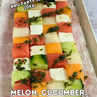Melon Cucumber Watermelon and Feta Tetris Salad Appetizer Bites - easy fruit and cheese appetizer board with cubed melon, cucumber, watermelon and feta arranged as a grid and Tetris salad with a drizzle of spicy mint vinaigrette.
