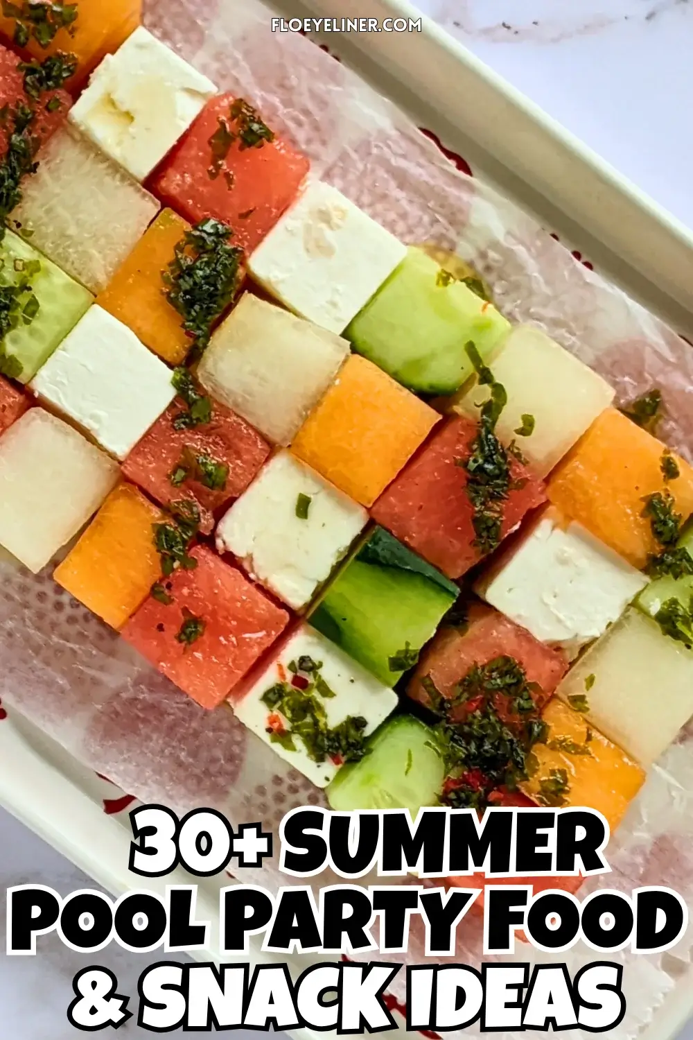 Melon Cucumber Watermelon and Feta Tetris Salad Appetizer Bites - easy fruit and cheese appetizer board with cubed melon, cucumber, watermelon and feta arranged as a grid and Tetris salad with a drizzle of spicy mint vinaigrette.