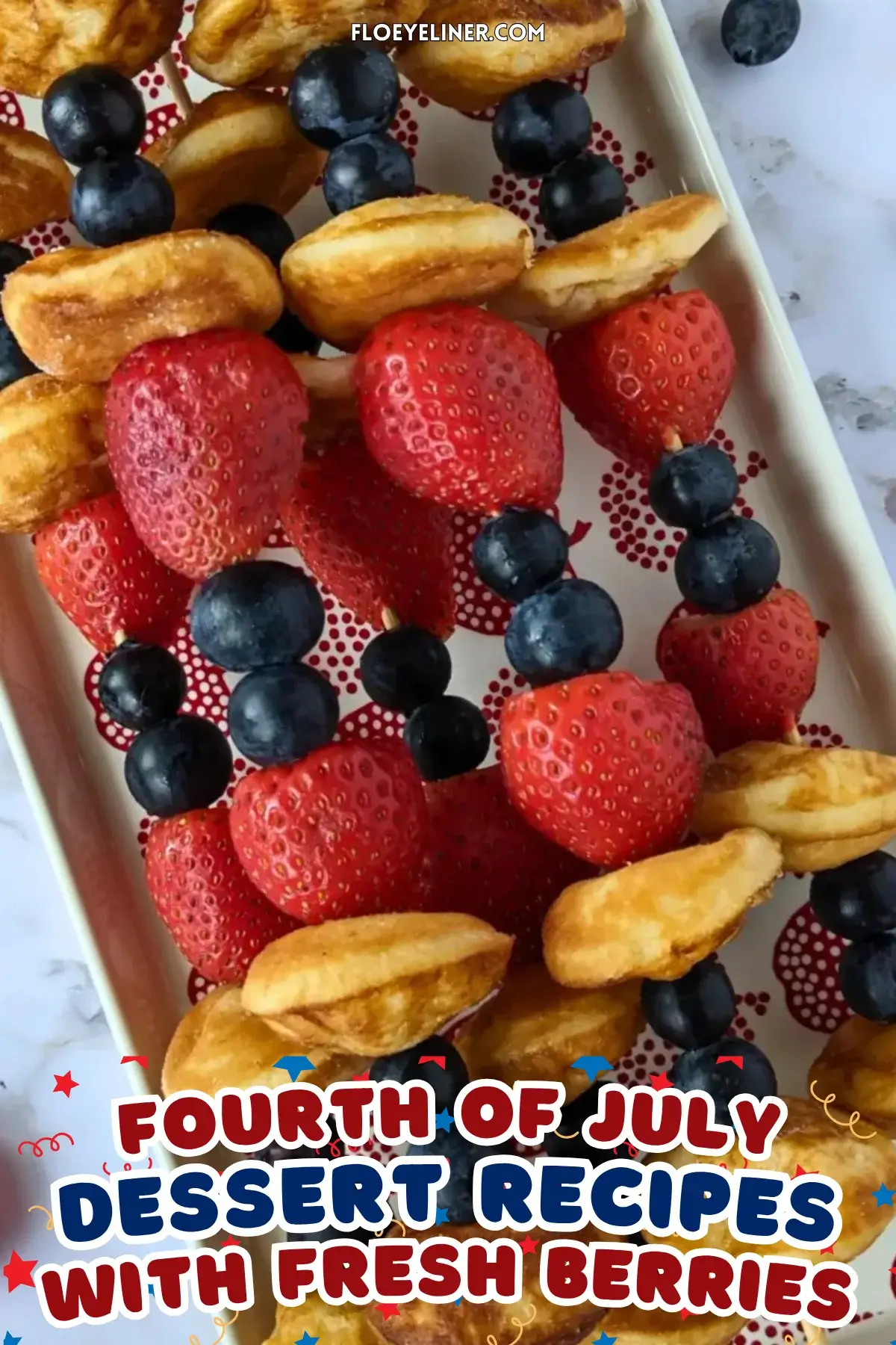 Mini Pancake Skewers With Fresh Berries - dessert skewers on toothpicks made with alternating layers of mini pancakes and fresh strawberries and blueberries.