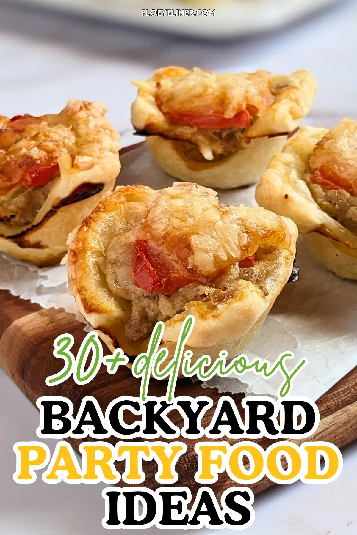 Mini Tuna Tart Cups With Puff Pastry - mini tuna tart appetizers made in a mini muffin tin with a canned tuna and sour cream filling and grated cheese topping in puff pastry cups.