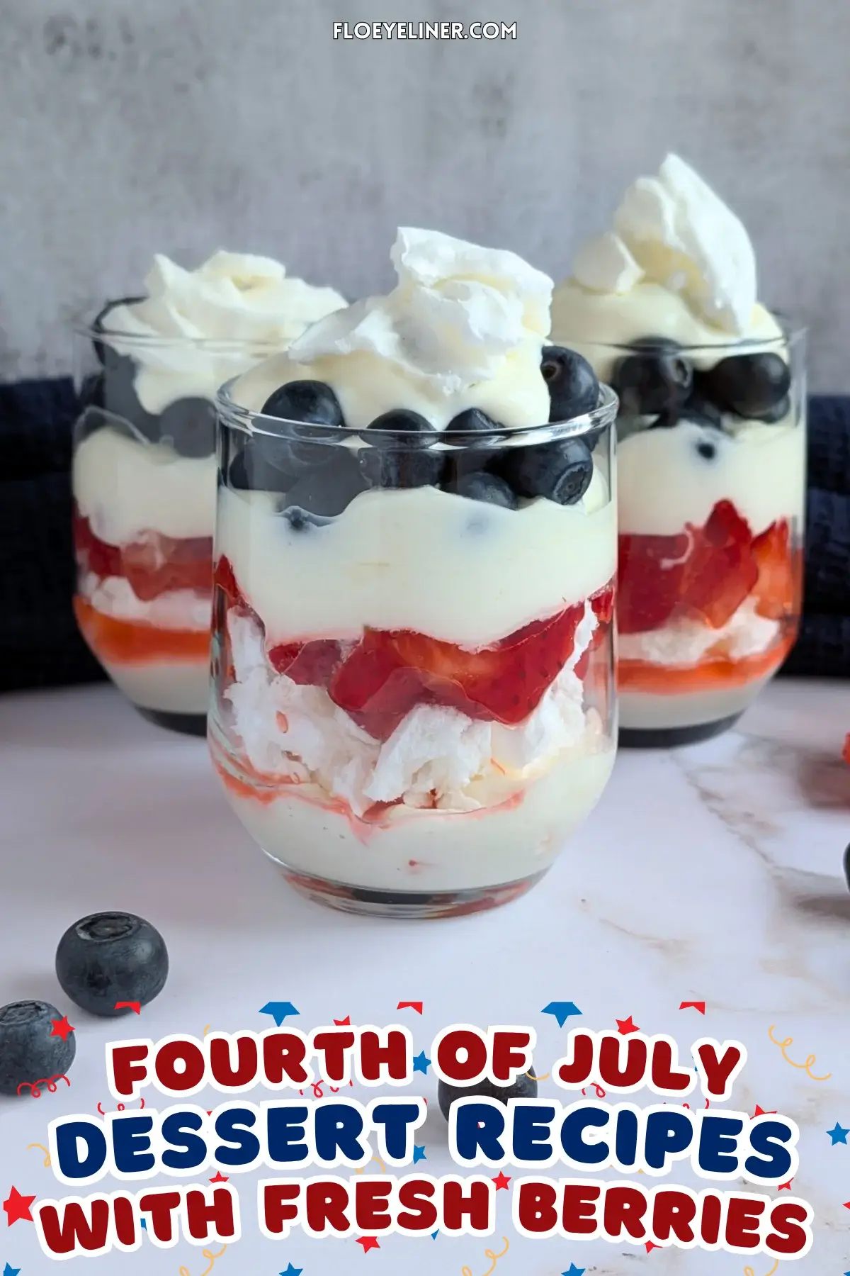 Mixed Berry Eton Mess Desserts - individual eton mess dessert cups, made with layers of mascarpone-whipped cream mix, crushed meringue, fresh strawberries, another layer of mascarpone-whipped cream mix, fresh blueberries, and topped with more cream and crushed meringue.