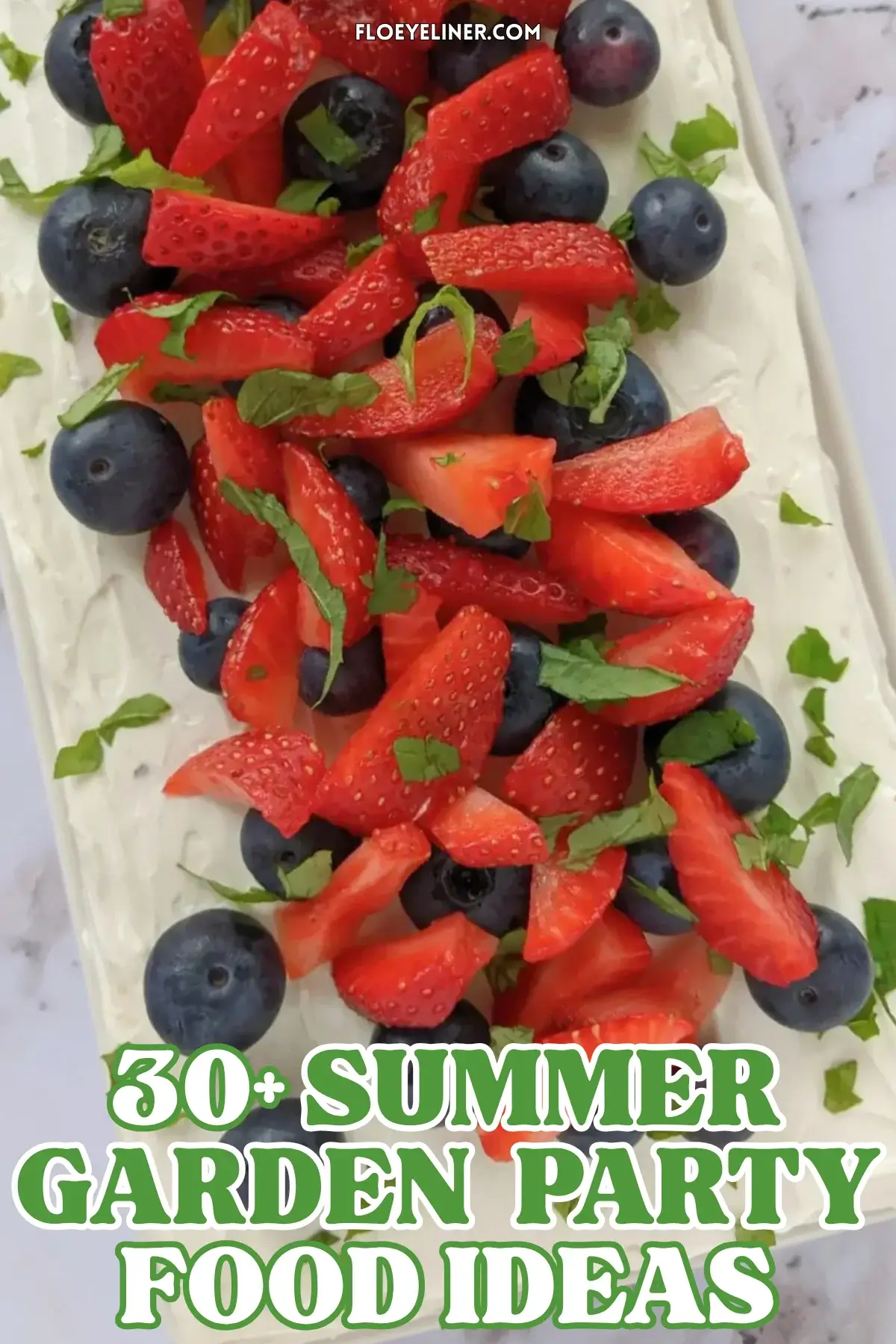 Mixed Berry Layer Cake With Mascarpone Greek Yogurt Frosting - triple-layer sponge cake with a blueberry-strawberry filling and mascarpone-Greek yogurt frosting, topped with fresh strawberries and blueberries.