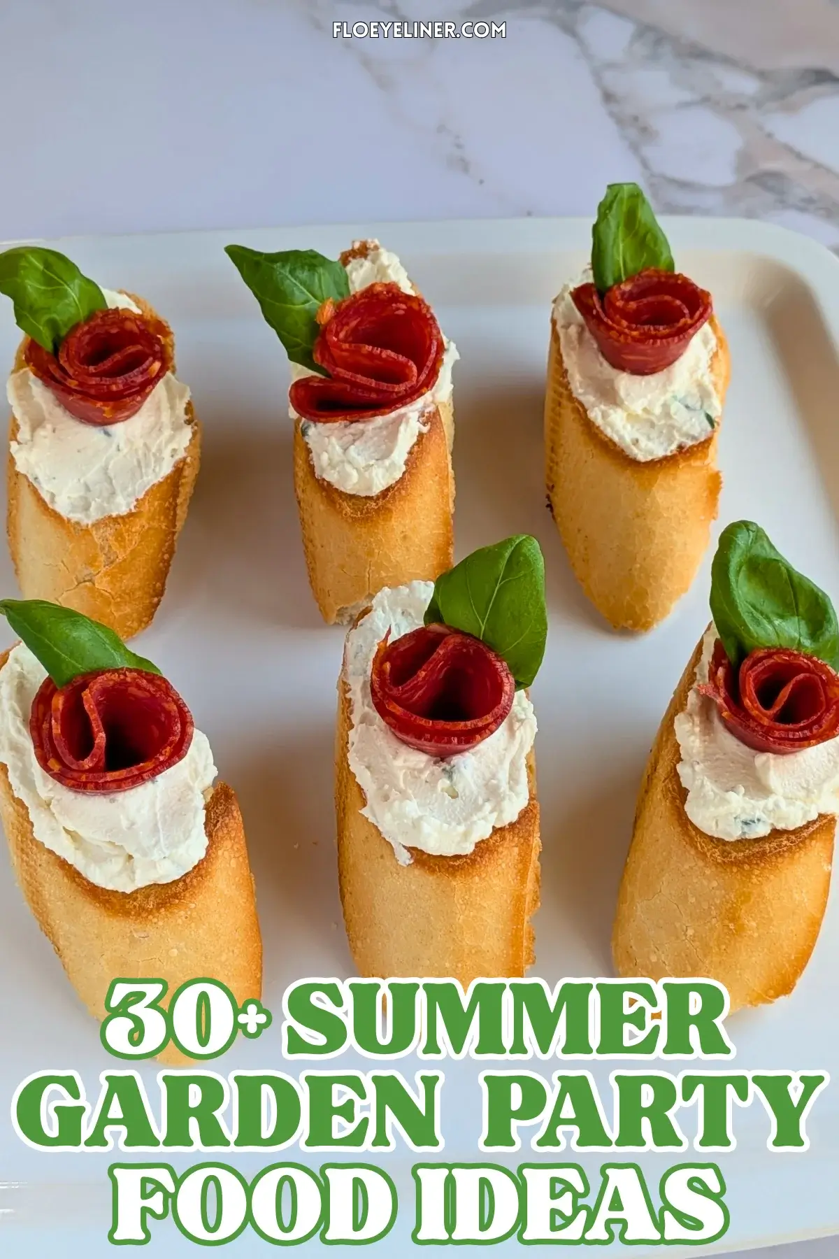 Pepperoni Rose Crostini Appetizers - oven-baked crostini toasts topped with homemade dried onion-fresh thyme cream cheese, slices of pepperoni rolled into roses, and fresh basil leaves for rose leaves.