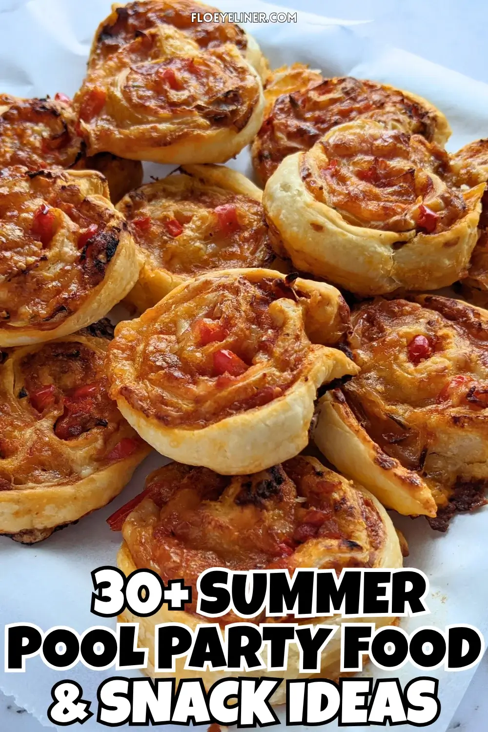 Pizza Pinwheels - Golden brown pizza pinwheels filled with tomato sauce, salami, and melted cheese.