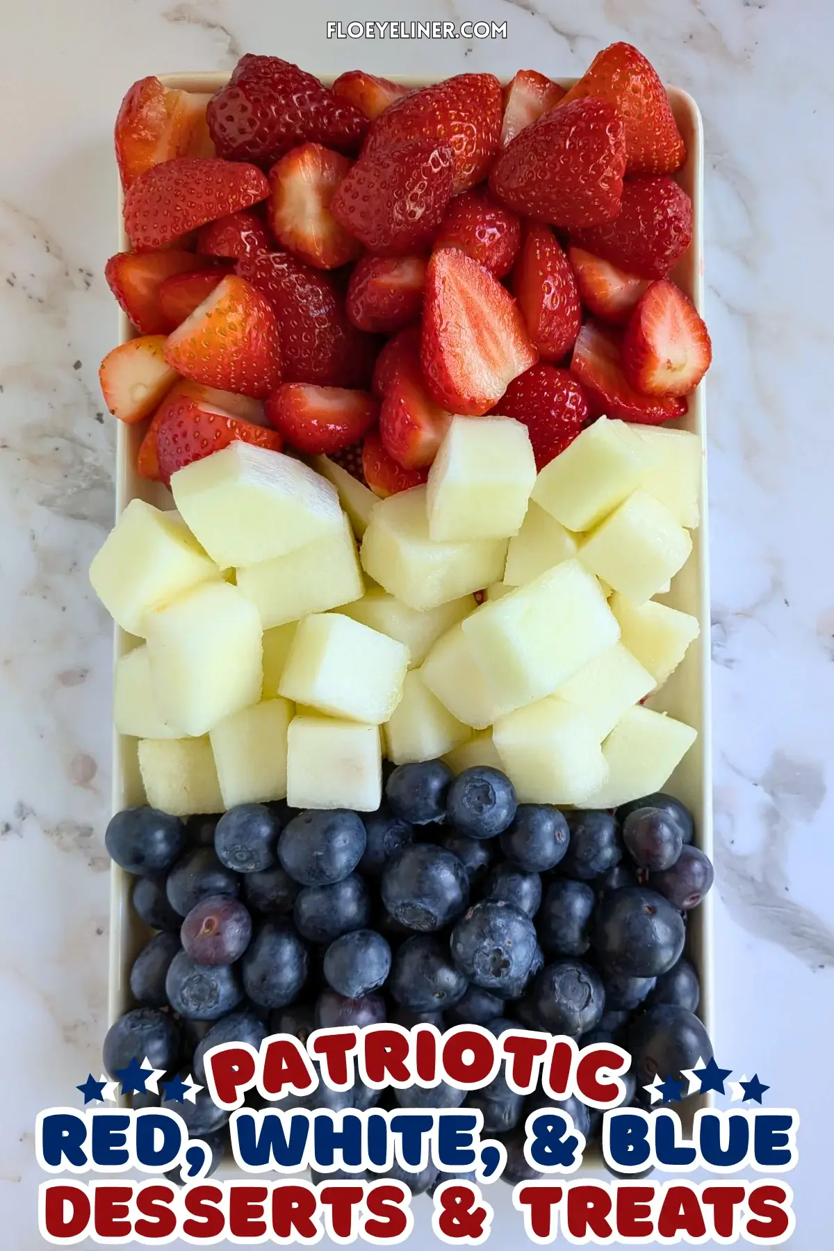 Red, White and Blue Fruit Tray - easy festive party fruit platter made with cut red strawberries, white honeydew melon, and blue blueberries for a red, white, and blue themed summer dessert or snack board.