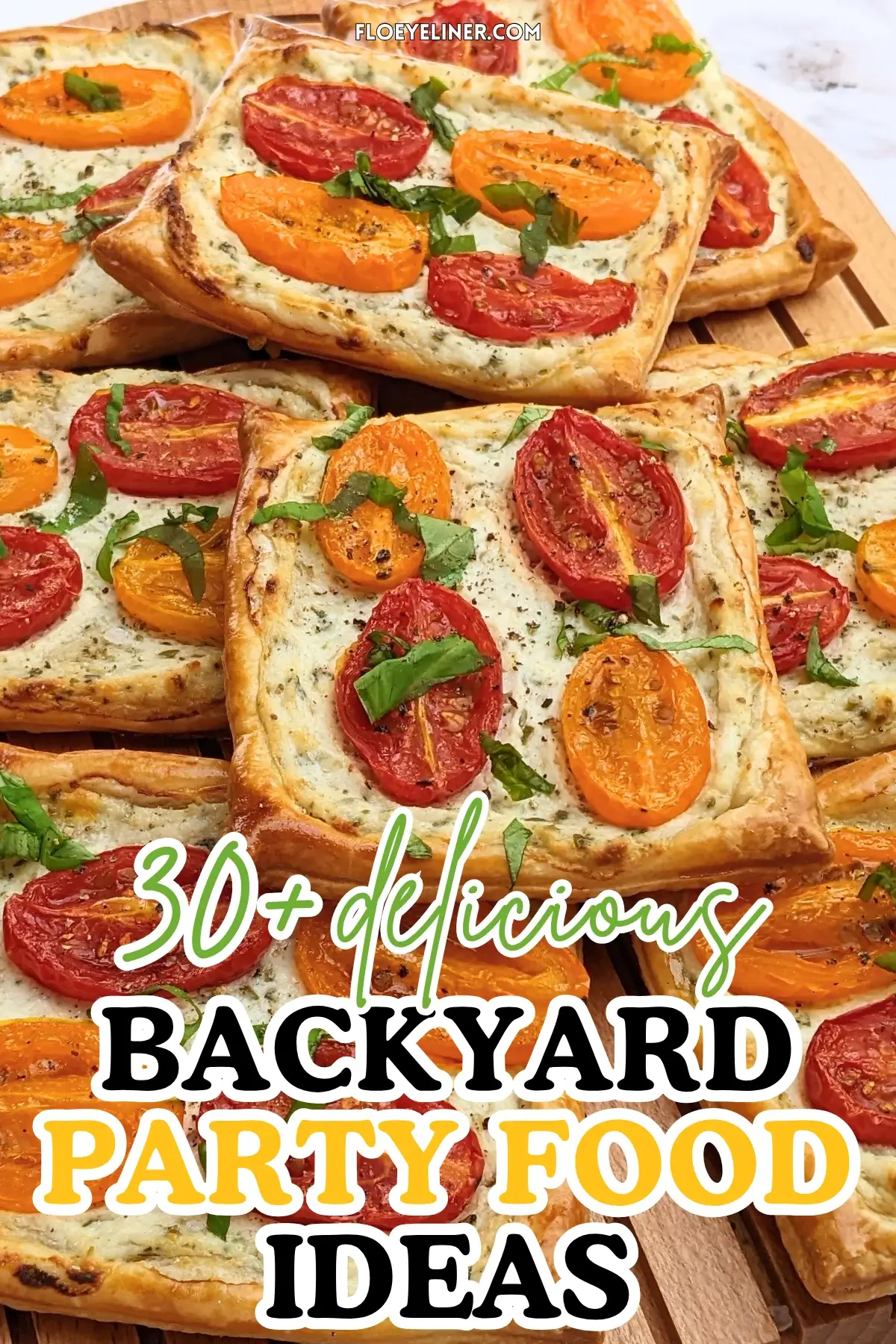Roasted cherry tomato tarts with puff pastry - a puff pastry appetizer filled with ricotta and parmesan and topped with red and yellow cherry tomatoes and basil.