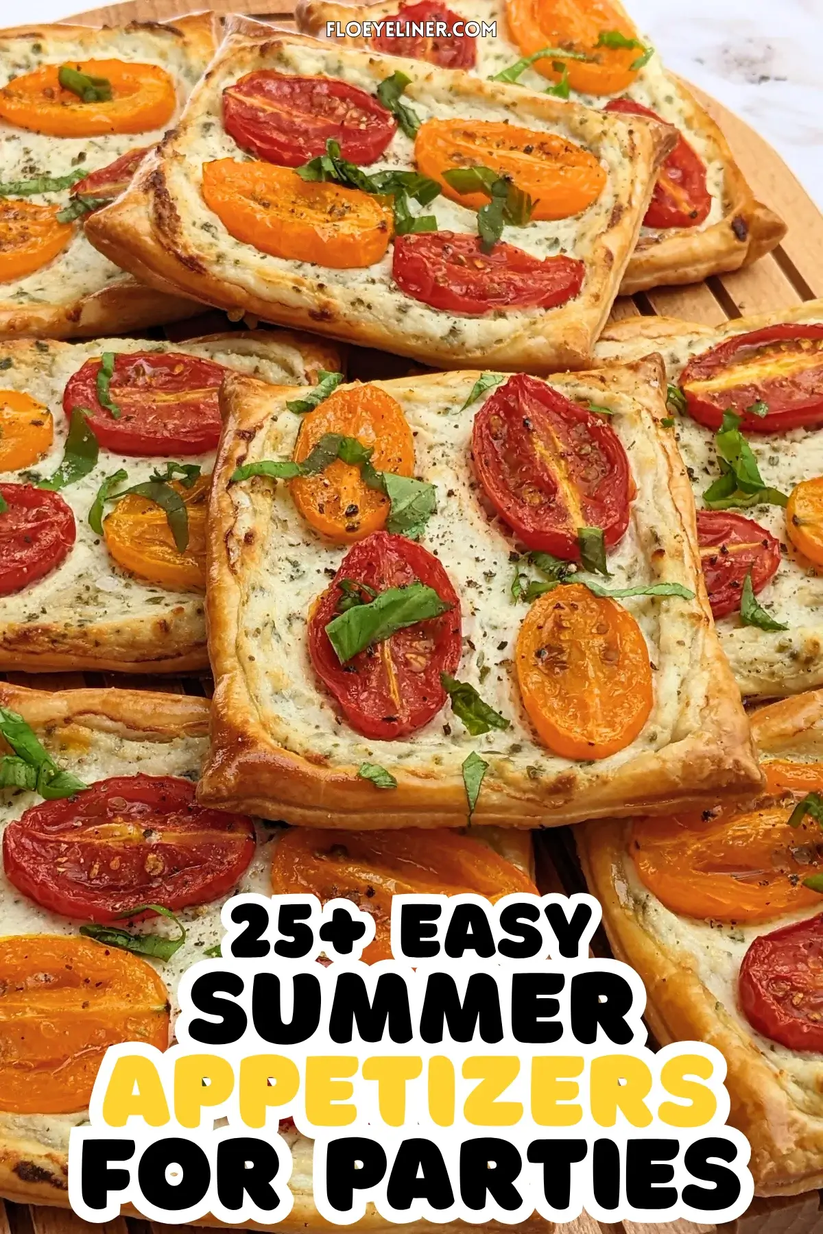 Roasted cherry tomato tarts with puff pastry - a puff pastry appetizer filled with ricotta and parmesan and topped with red and yellow cherry tomatoes and basil.