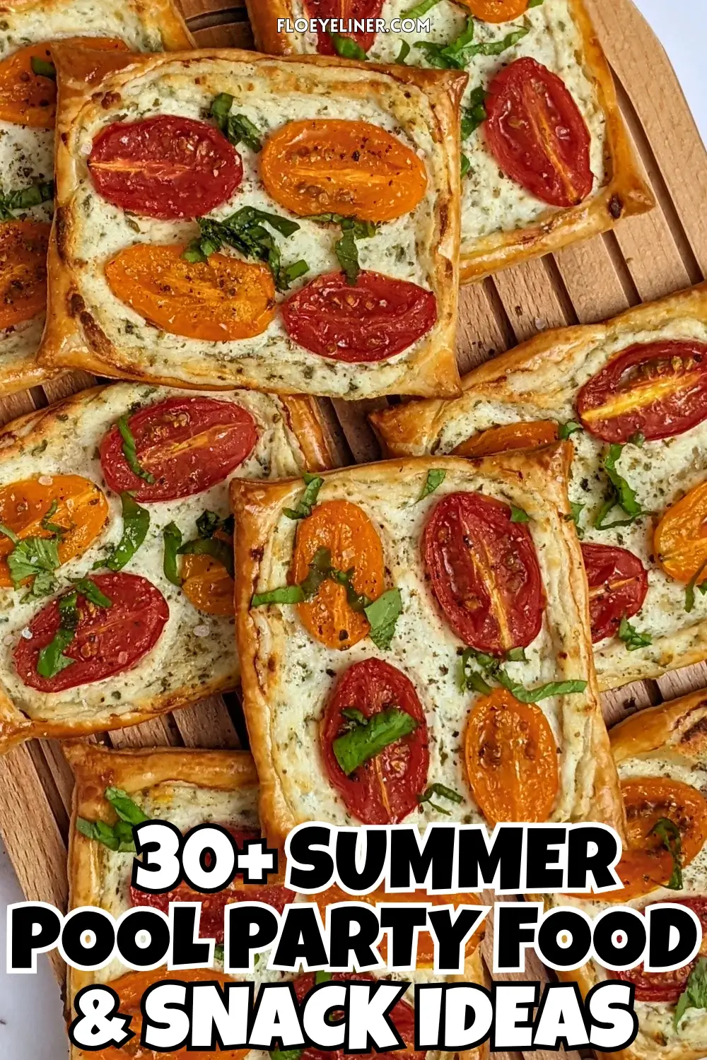 Roasted cherry tomato tarts with puff pastry - a puff pastry appetizer filled with ricotta and parmesan and topped with red and yellow cherry tomatoes and basil.