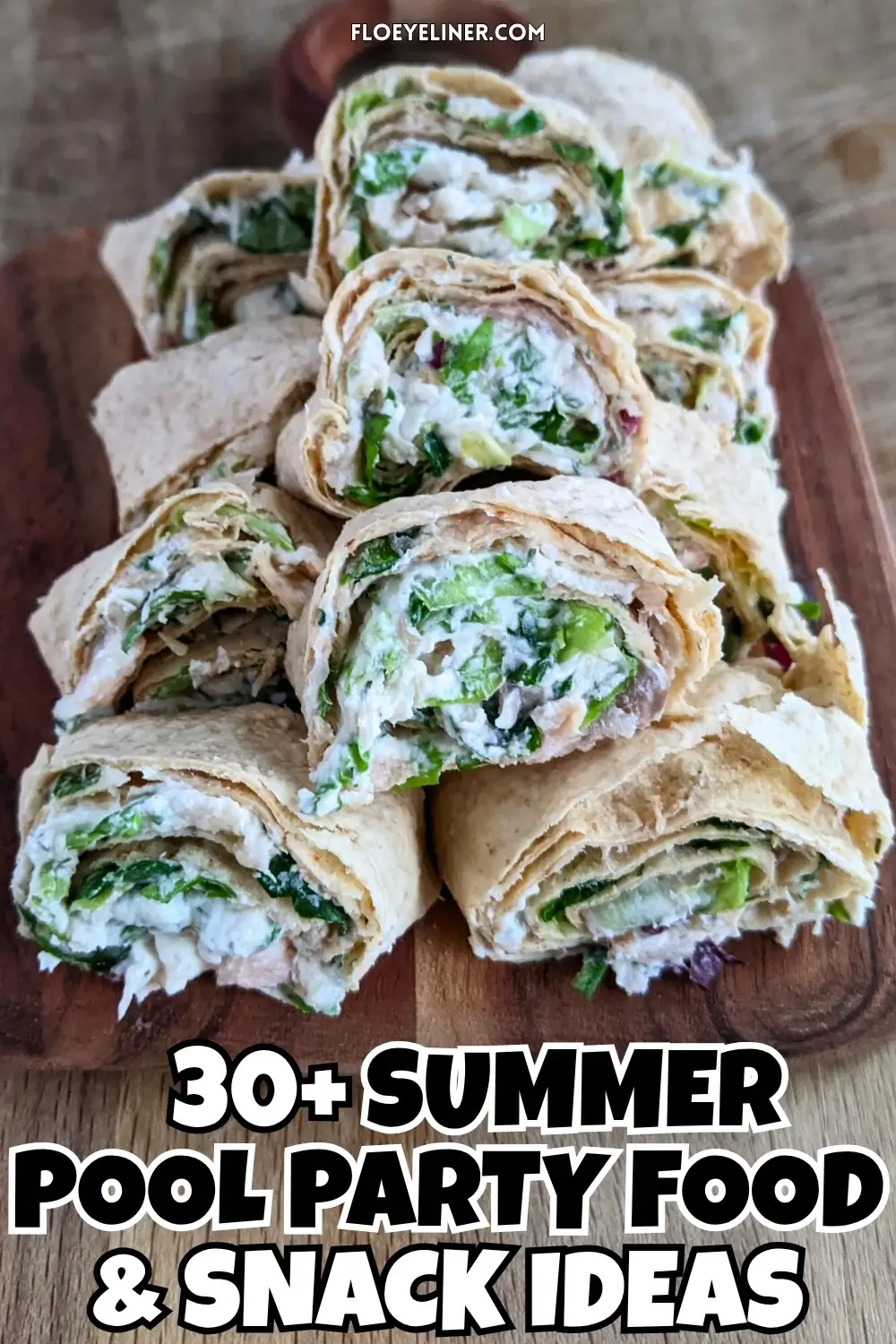 Smoked salmon flatbread appetizers sliced into pinwheels filled with salmon-cream cheese spread and fresh greens.