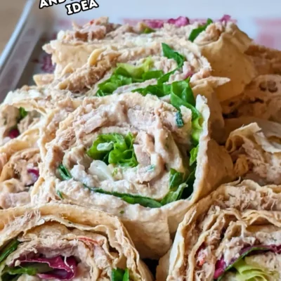 Spicy Tuna Roll Appetizers With Flatbread - spicy tuna rolls/pinwheels made with lavash flatbread and filled with a mix of tuna, mustard, Greek yogurt and fresh salad leaves.