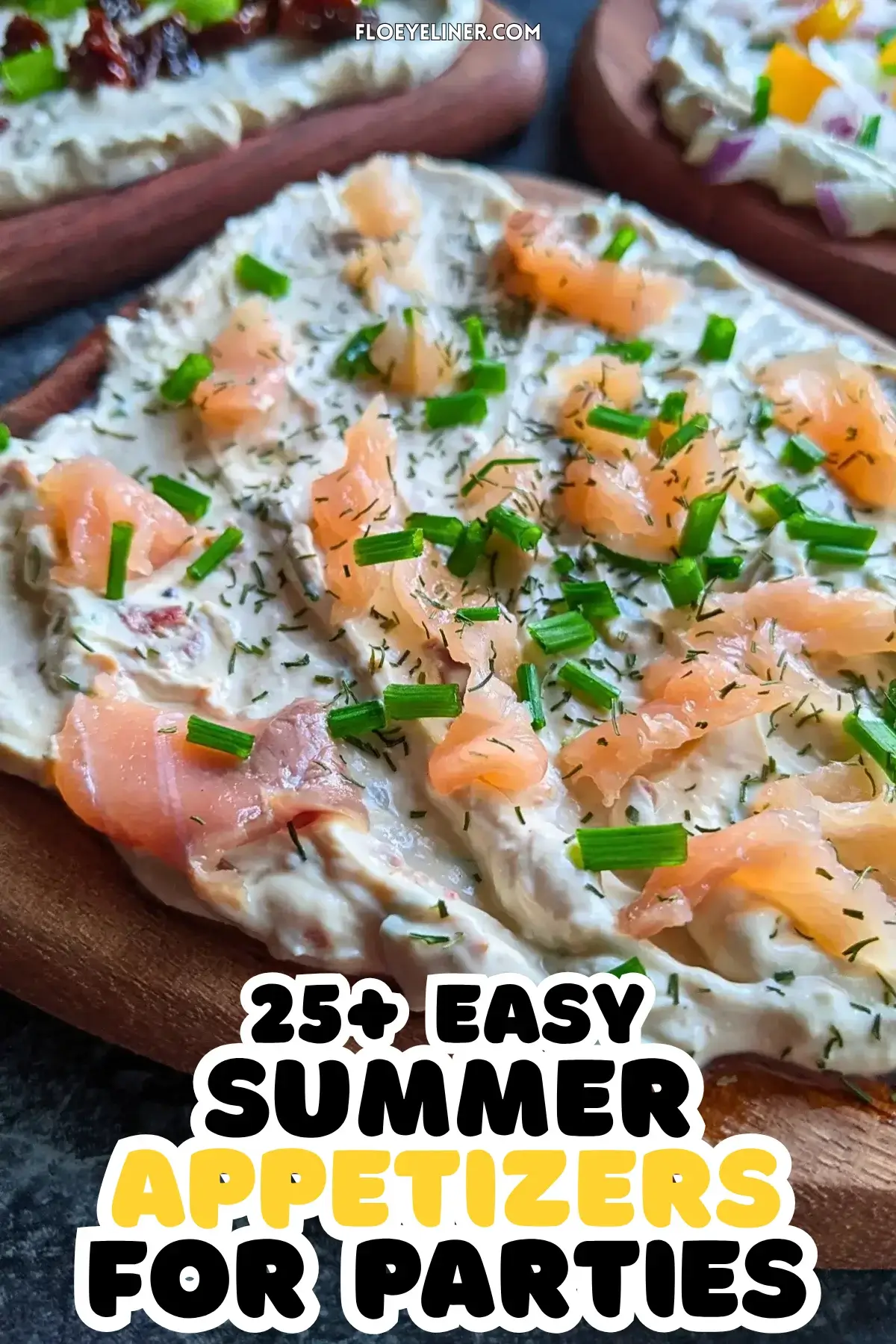 Trio of whipped feta board appetizers, one topped with smoked salmon and fresh chives, the other with sun-dried tomatoes and fresh green onions, and the third with yellow bell peppers, red onion, and fresh chives, all on a creamy feta dip base.
