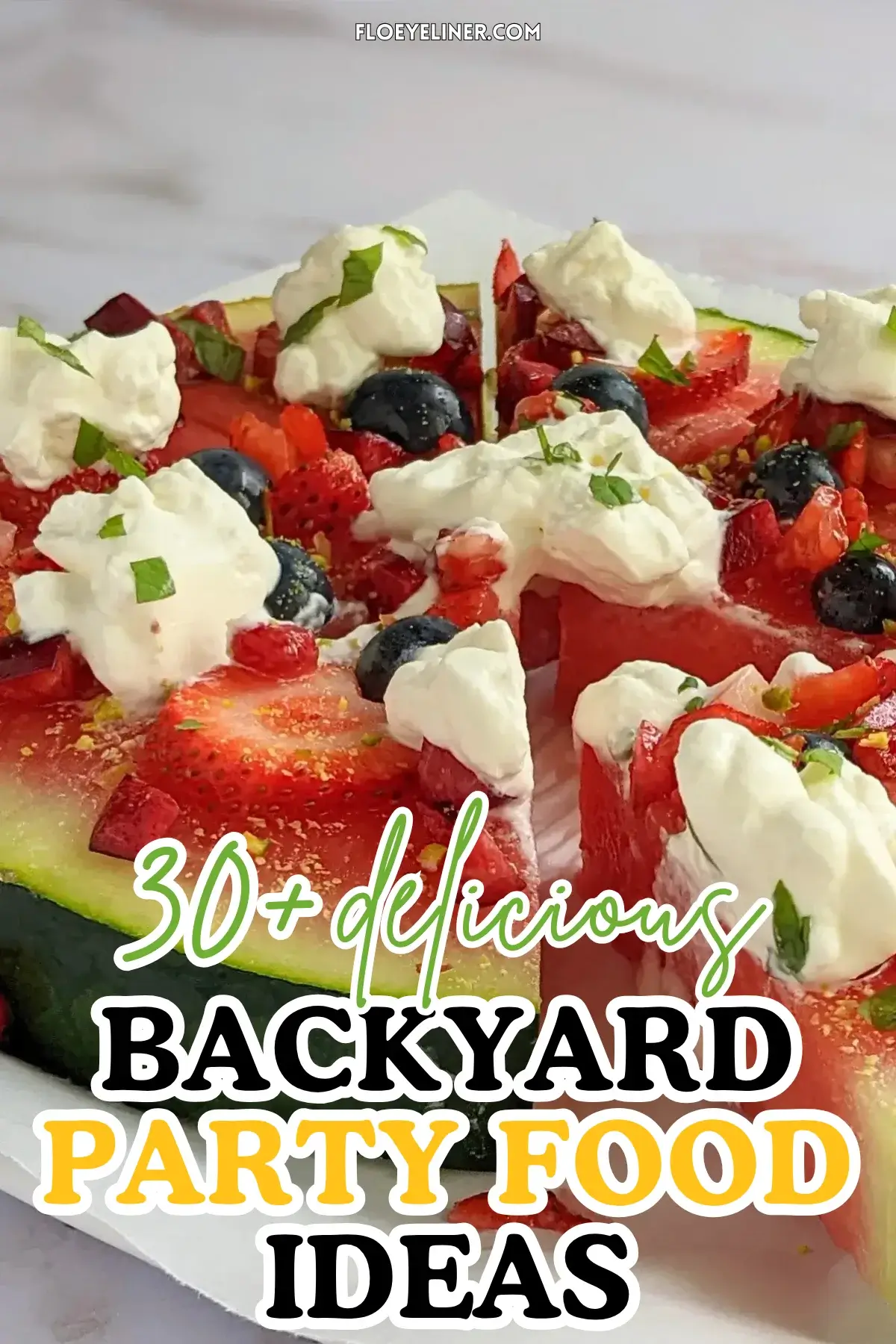 Watermelon Fruit Pizza With Berries and Whipped Cream - fruity dessert pizza on a base of a fresh watermelon slice, topped with blueberries, strawberries, cherries, dollops of whipped cream, and crushed pistachios.