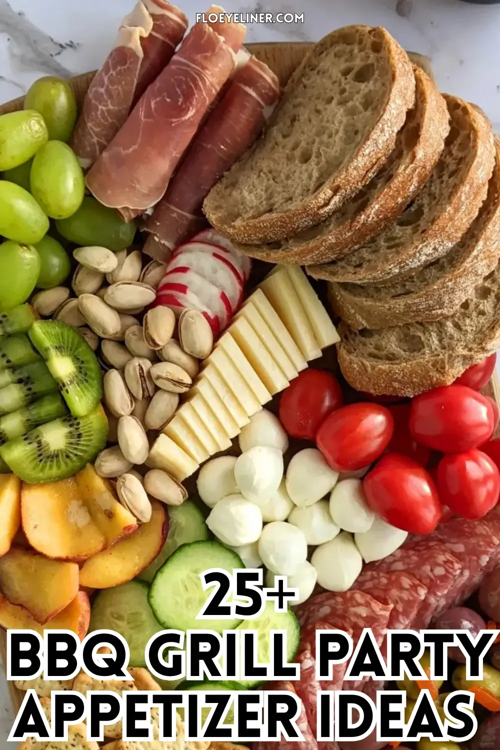 Colorful Antipasto Party Food Platter - A vibrant colorful antipasto party food platter with cured meats, marinated veggies, cheeses, olives, fruit, and ciabatta arranged on a wooden platter.