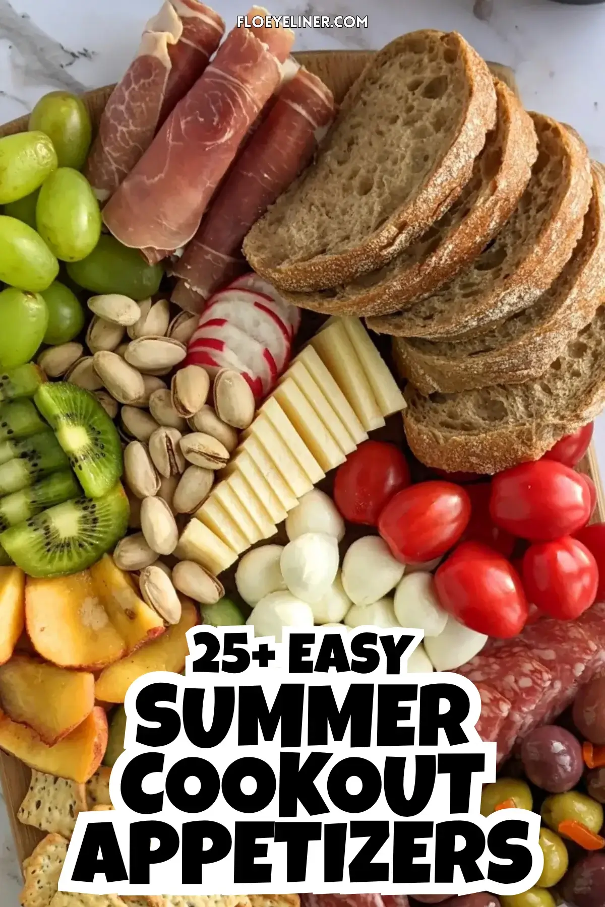 Colorful Antipasto Party Food Platter - A vibrant colorful antipasto party food platter with cured meats, marinated veggies, cheeses, olives, fruit, and ciabatta arranged on a wooden platter.