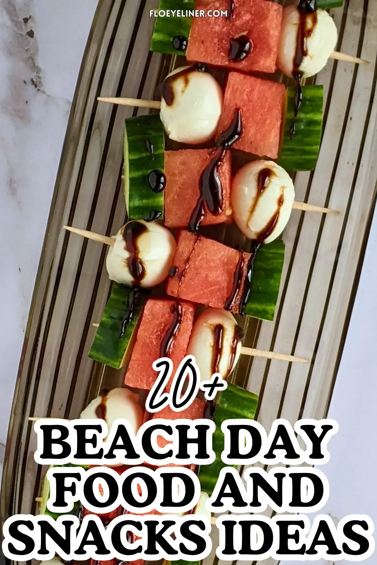 Cucumber Mozzarella Watermelon Appetizer Bites - fruit and cheese skewers made with cubes of watermelon and cucumber on toothpicks, paired with mini mozzarella balls and drizzled with balsamic glaze.
