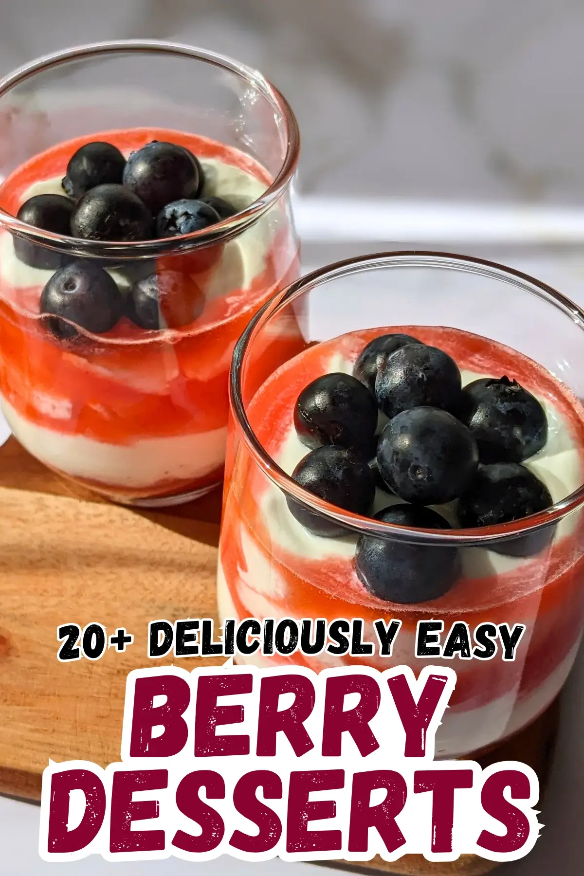 Greek Yogurt Strawberry Fool - whipped Greek yogurt, whipped cream, and strawberry dessert made with alternating layers of stewed strawberries and yogurt-whipped cream mix, topped with blueberries for an extra burst of color.