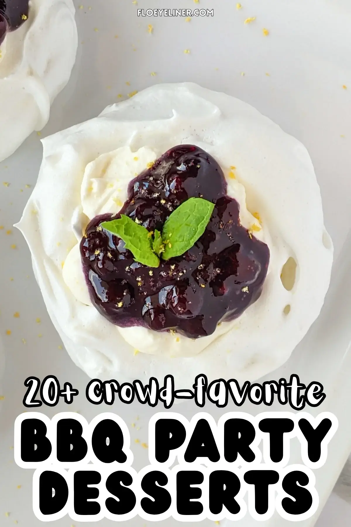 Lemon Blueberry Mini Pavlovas With Cheesecake Filling - mini pavlova nests filled with homemade lemon blueberry jam and a lemony cheesecake filling, topped with more blueberry jam and lemon zest for garnish.