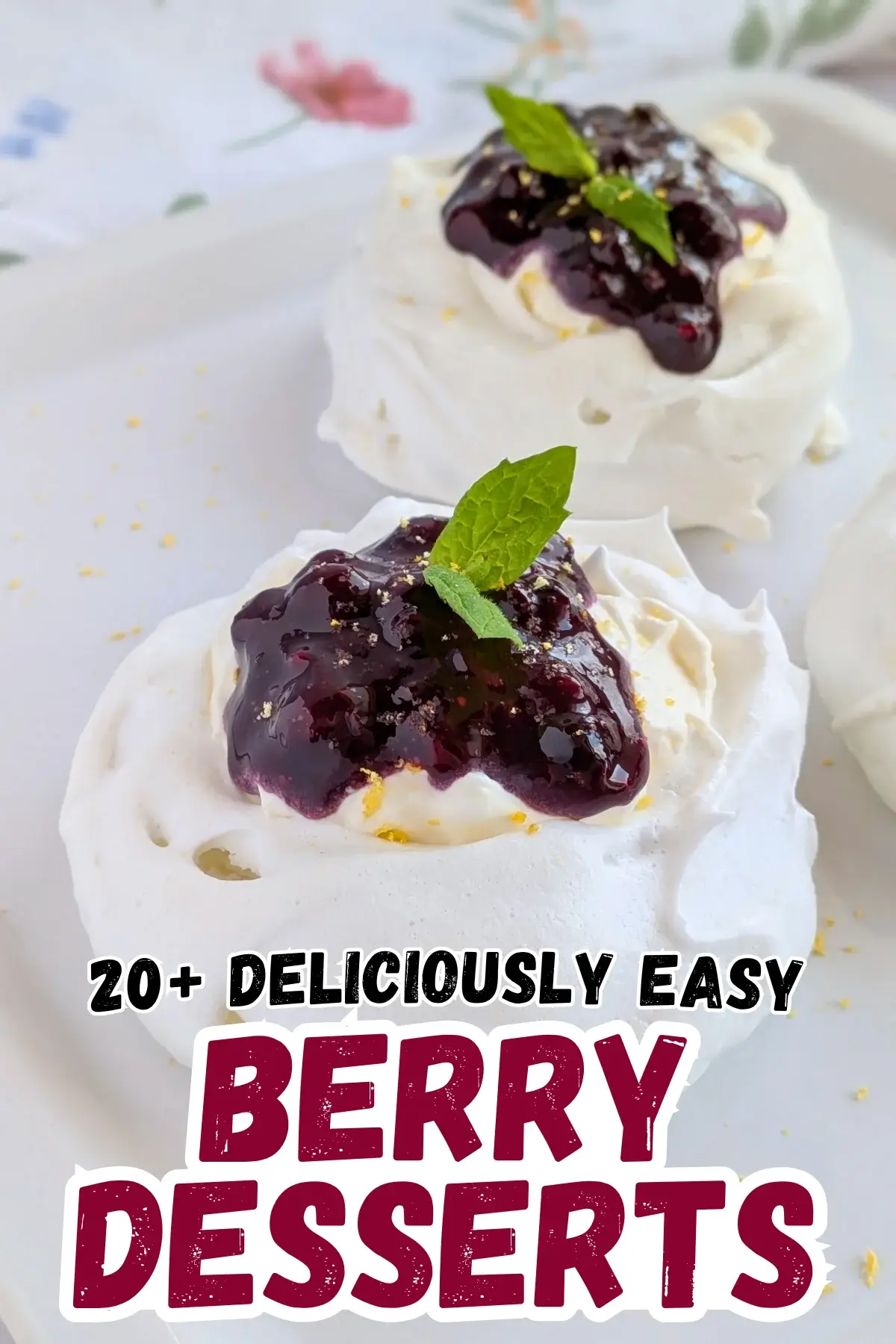 Lemon Blueberry Mini Pavlovas With Cheesecake Filling - mini pavlova nests filled with homemade lemon blueberry jam and a lemony cheesecake filling, topped with more blueberry jam and lemon zest for garnish.