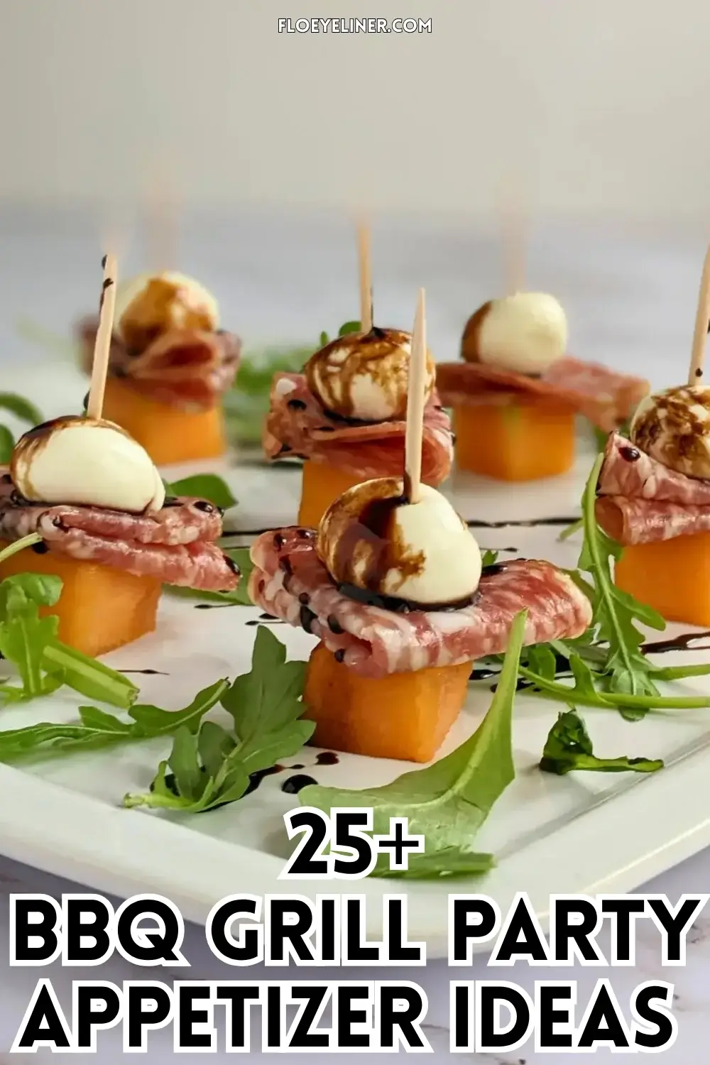 Melon and Salami Toothpick Appetizers With Mozzarella - easy fruit and cheese skewers made with melon, dried salami, and mini mozzarella balls served on a bed of arugula and topped with a balsamic glaze.