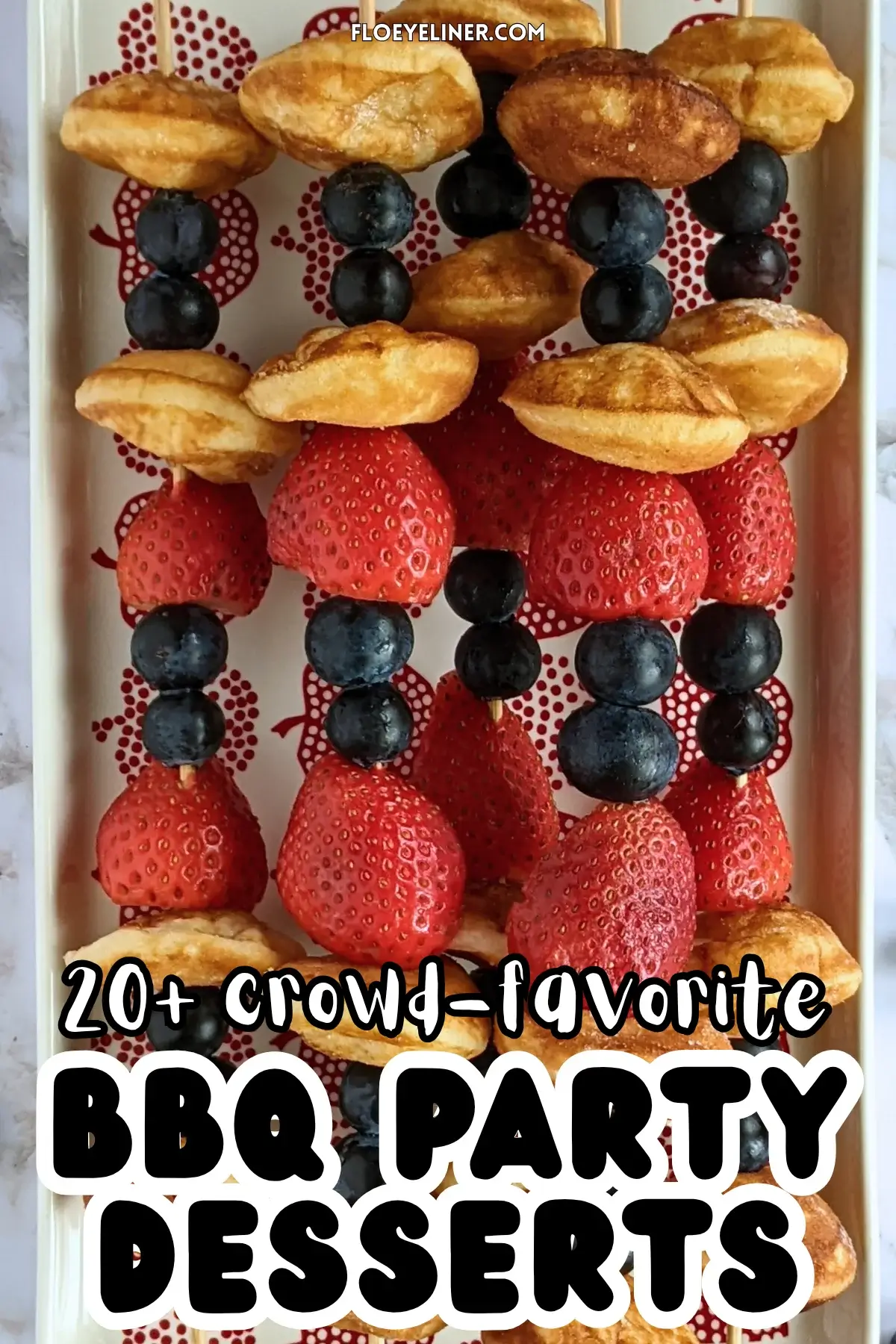 Mini Pancake Skewers With Fresh Berries - dessert skewers on toothpicks made with alternating layers of mini pancakes and fresh strawberries and blueberries.