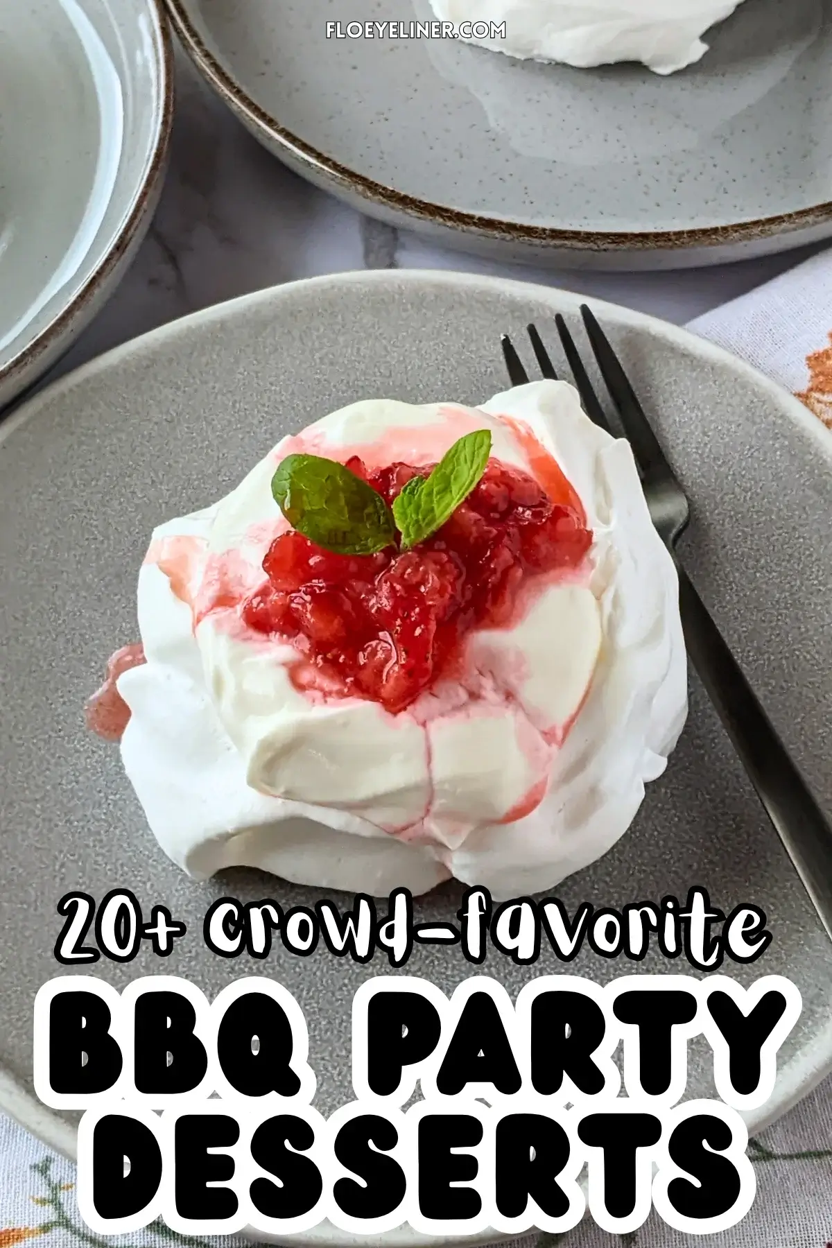 Mini Strawberry Pavlovas With Whipped Greek Yogurt - mini pavlova nests filled with freshly crushed strawberries and a whipped cream-Greek yogurt mix, topped with more crushed strawberries and strawberry juice for garnish.