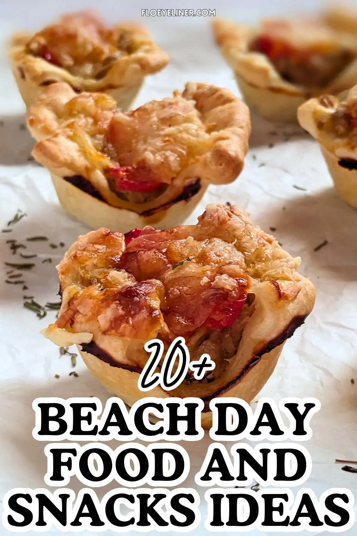 Mini Tuna Tart Cups With Puff Pastry - mini tuna tart appetizers made in a mini muffin tin with a canned tuna and sour cream filling and grated cheese topping in puff pastry cups.