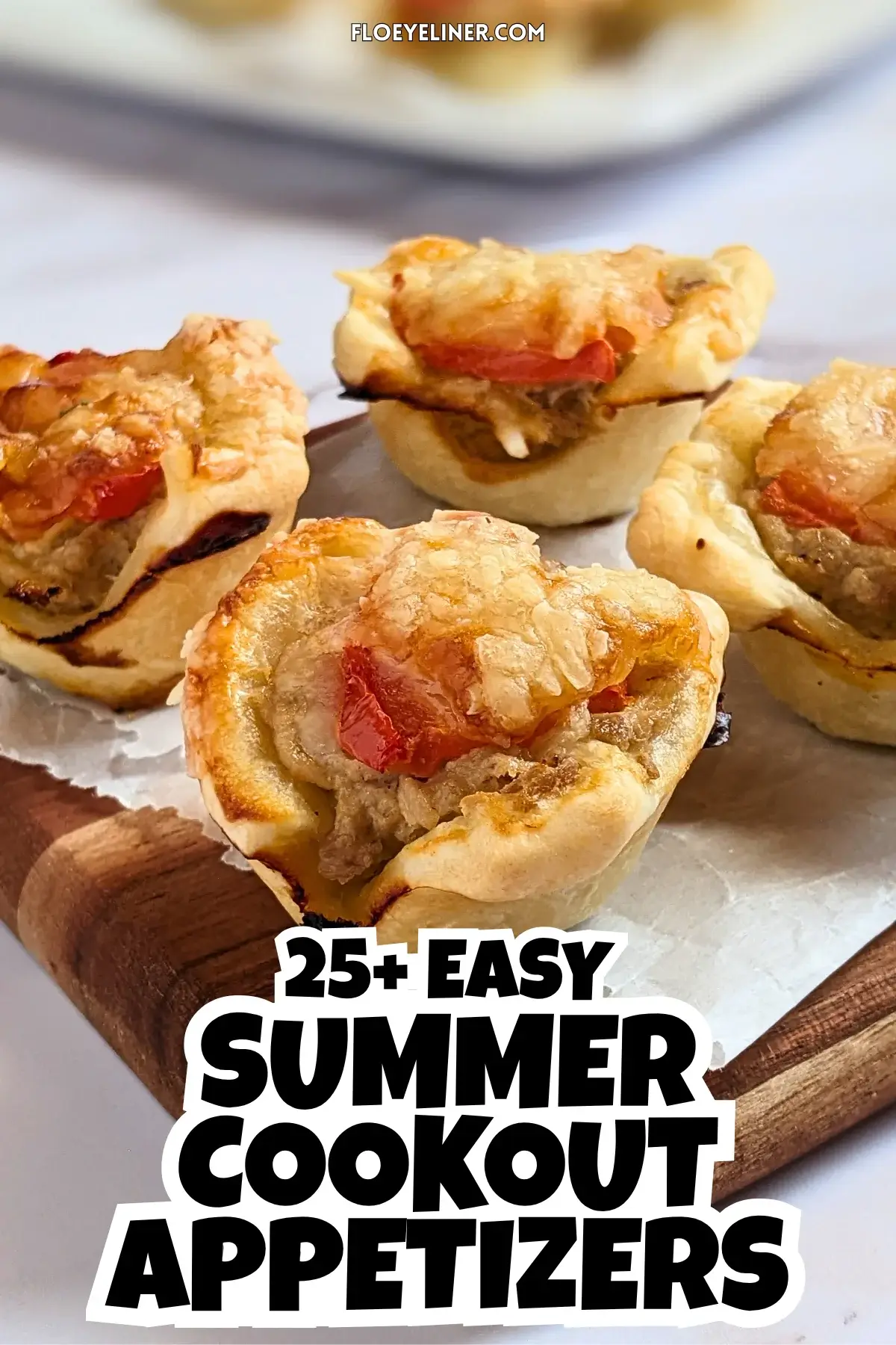 Mini Tuna Tart Cups With Puff Pastry - mini tuna tart appetizers made in a mini muffin tin with a canned tuna and sour cream filling and grated cheese topping in puff pastry cups.