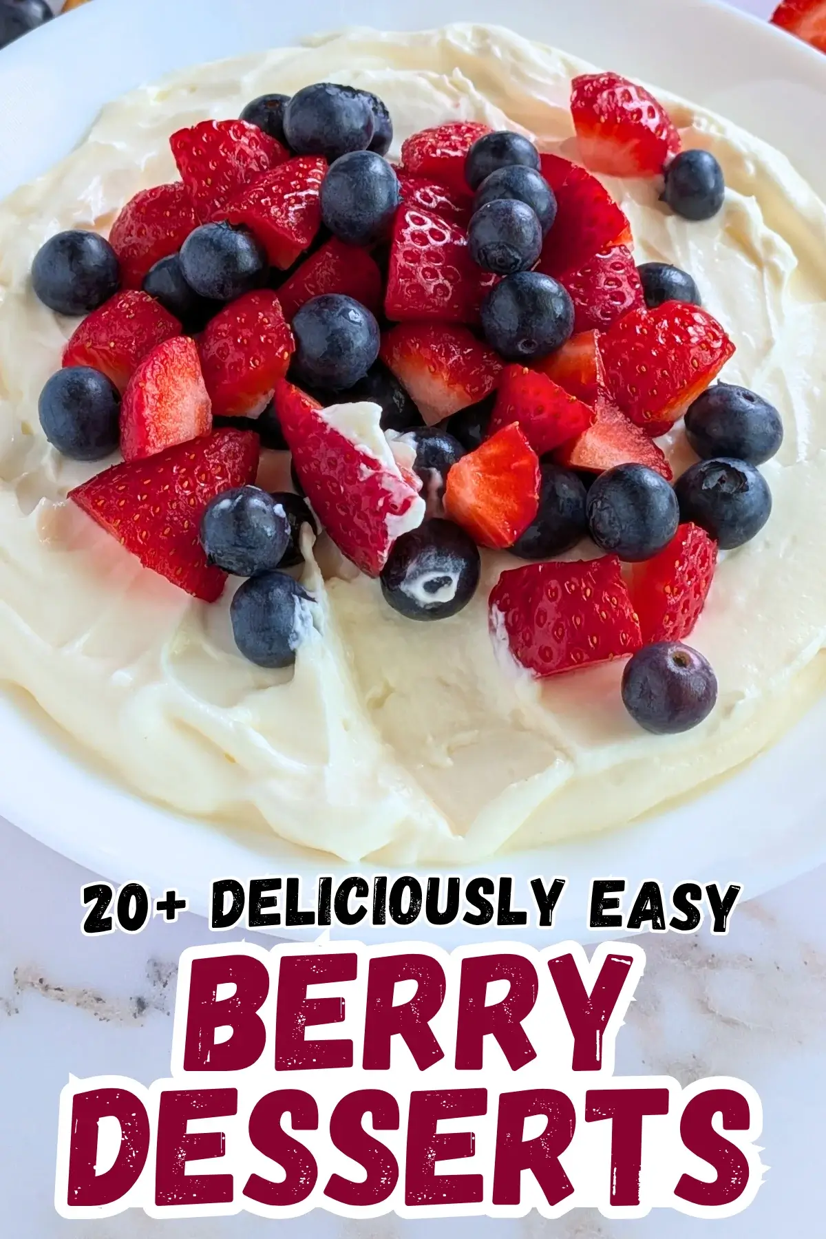 Mixed Berry Cheesecake Dessert Dip - fluffy cheesecake dip dessert made with cream cheese, heavy whipping cream, Greek yogurt, and topped with fresh strawberries and blueberries.