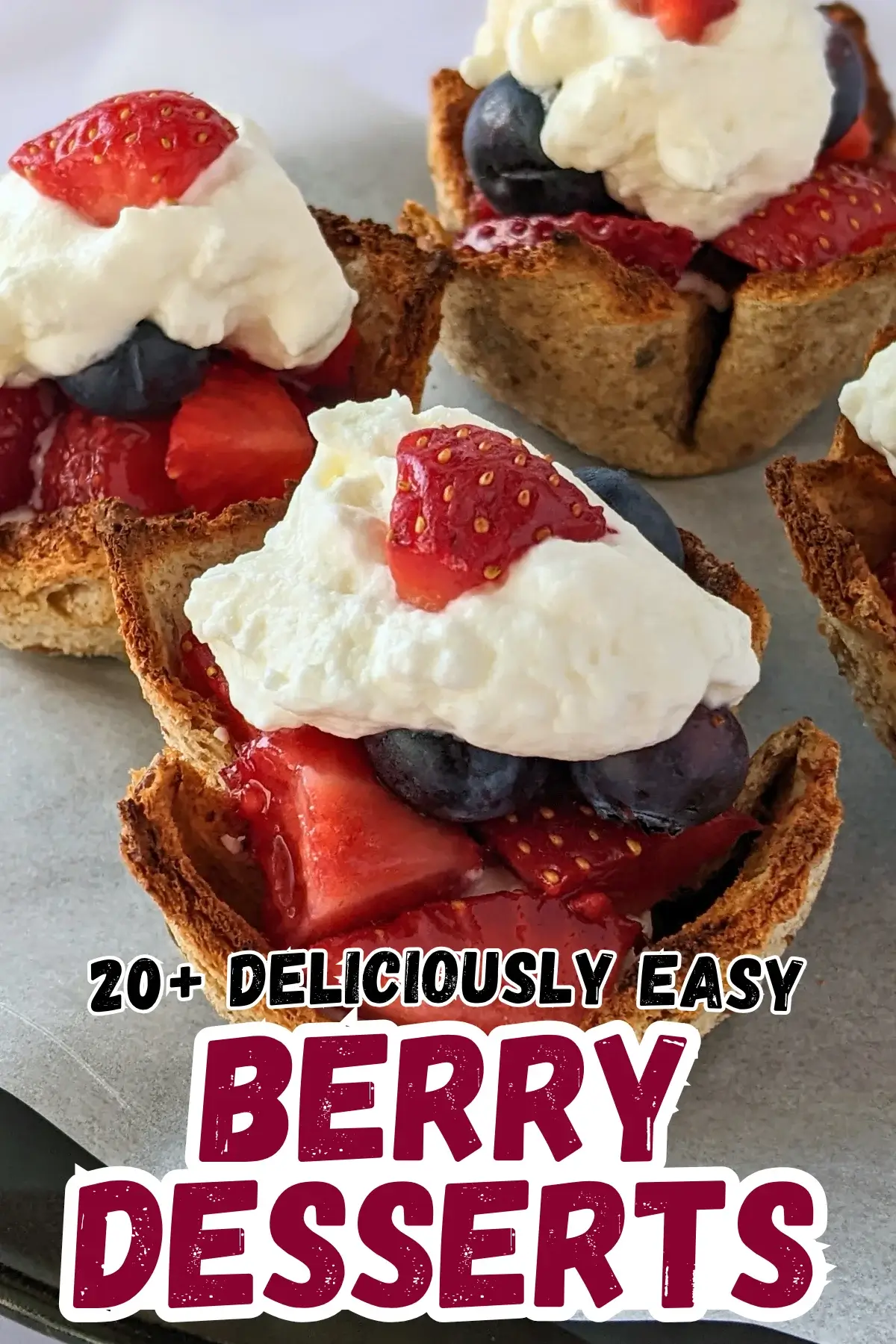 Mixed Berry Dessert Toast Cups With Whipped Cream - muffin-tin baked mini dessert cups made from white bread, filled with a spoon of sweet ricotta and mixed berries like strawberries and blueberries, topped with whipped cream.