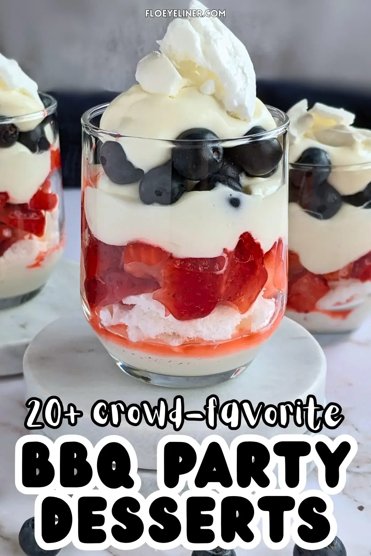 Mixed Berry Eton Mess Desserts - individual eton mess dessert cups, made with layers of mascarpone-whipped cream mix, crushed meringue, fresh strawberries, another layer of mascarpone-whipped cream mix, fresh blueberries, and topped with more cream and crushed meringue.
