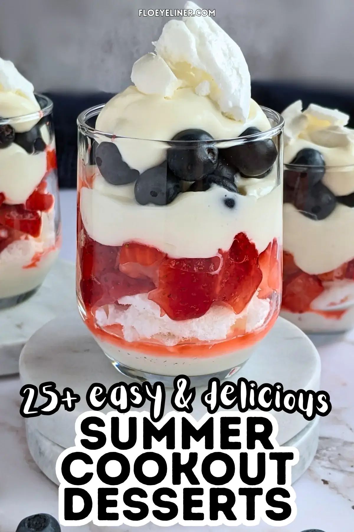 Mixed Berry Eton Mess Desserts - individual eton mess dessert cups, made with layers of mascarpone-whipped cream mix, crushed meringue, fresh strawberries, another layer of mascarpone-whipped cream mix, fresh blueberries, and topped with more cream and crushed meringue.