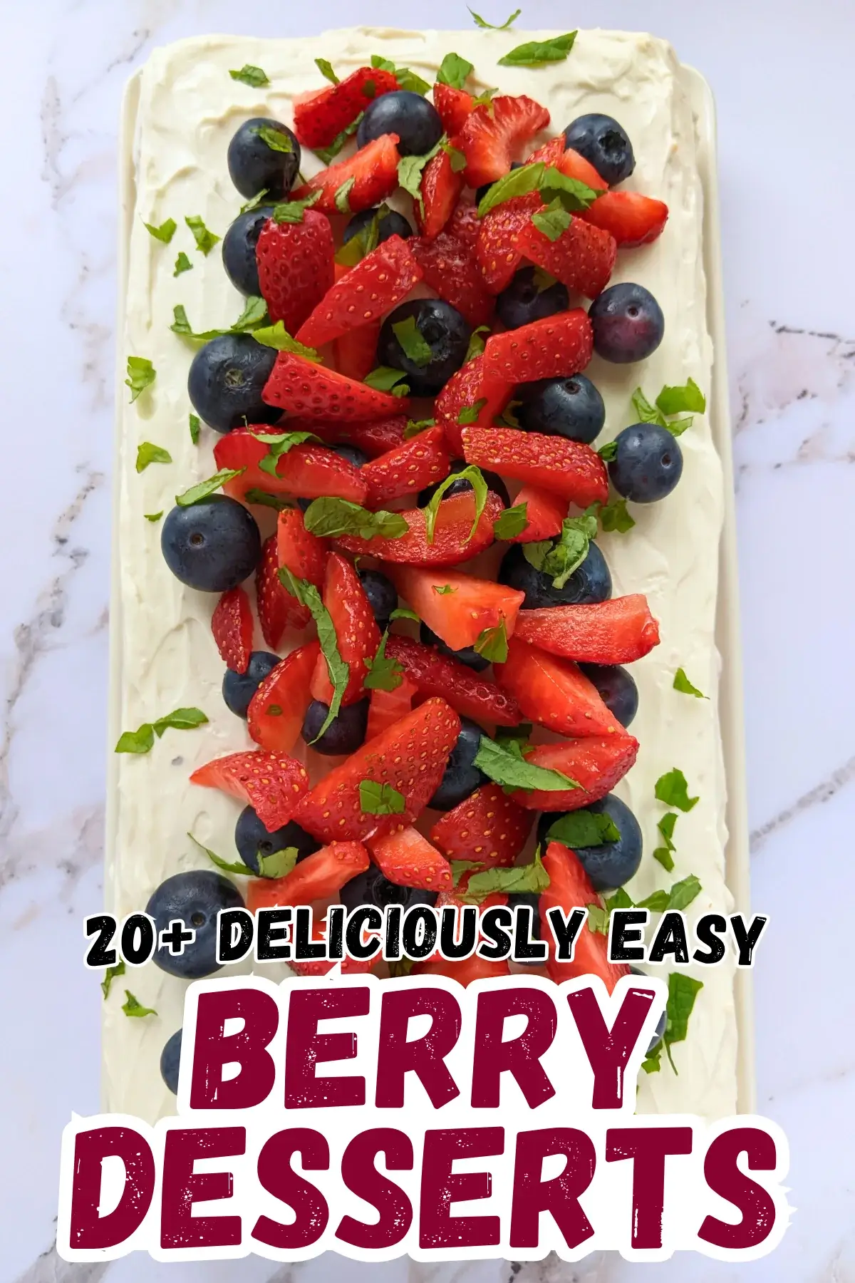 Mixed Berry Layer Cake With Mascarpone Greek Yogurt Frosting - triple-layer sponge cake with a blueberry-strawberry filling and mascarpone-Greek yogurt frosting, topped with fresh strawberries and blueberries.