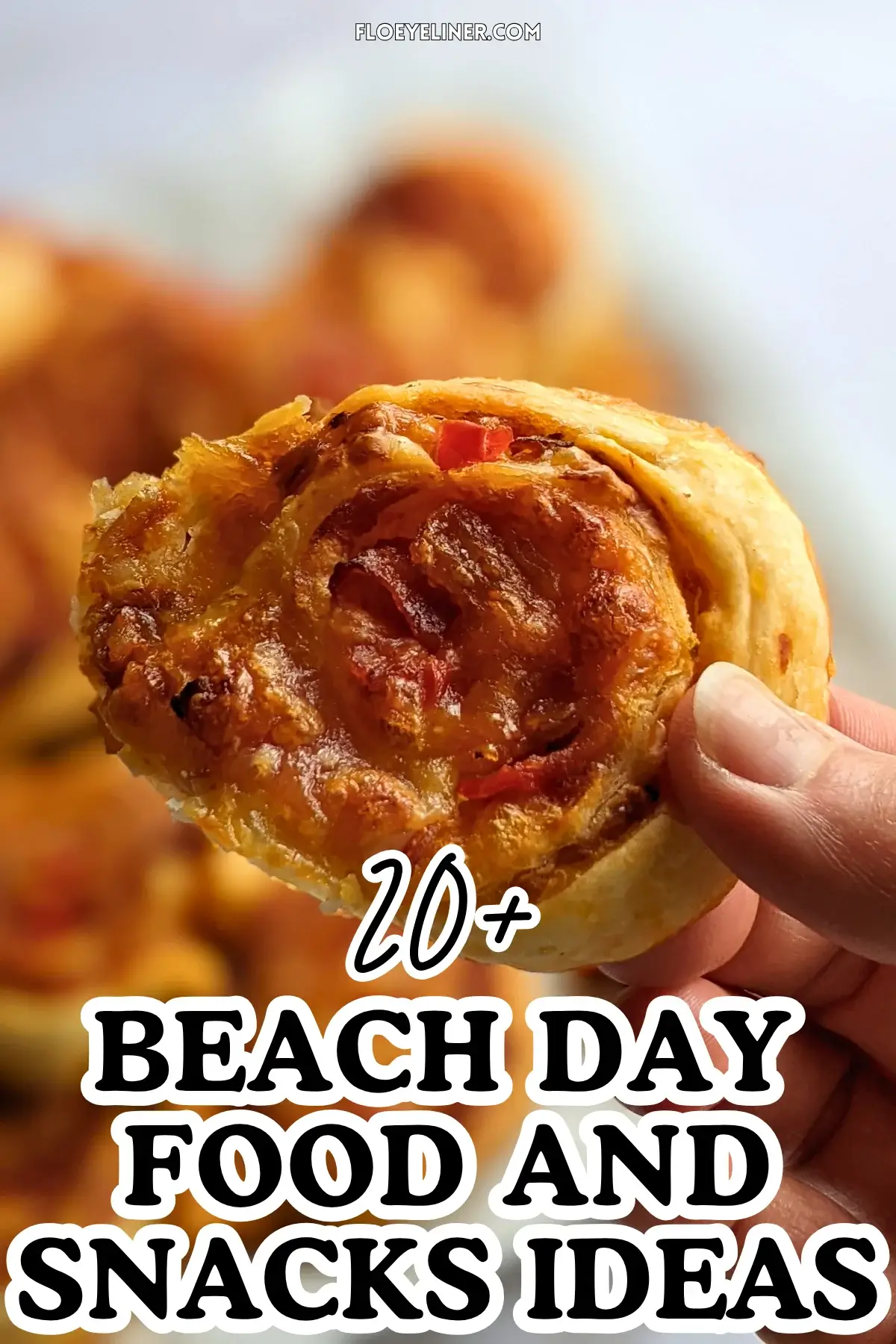 Pizza Pinwheels - Golden brown pizza pinwheels filled with tomato sauce, salami, and melted cheese.