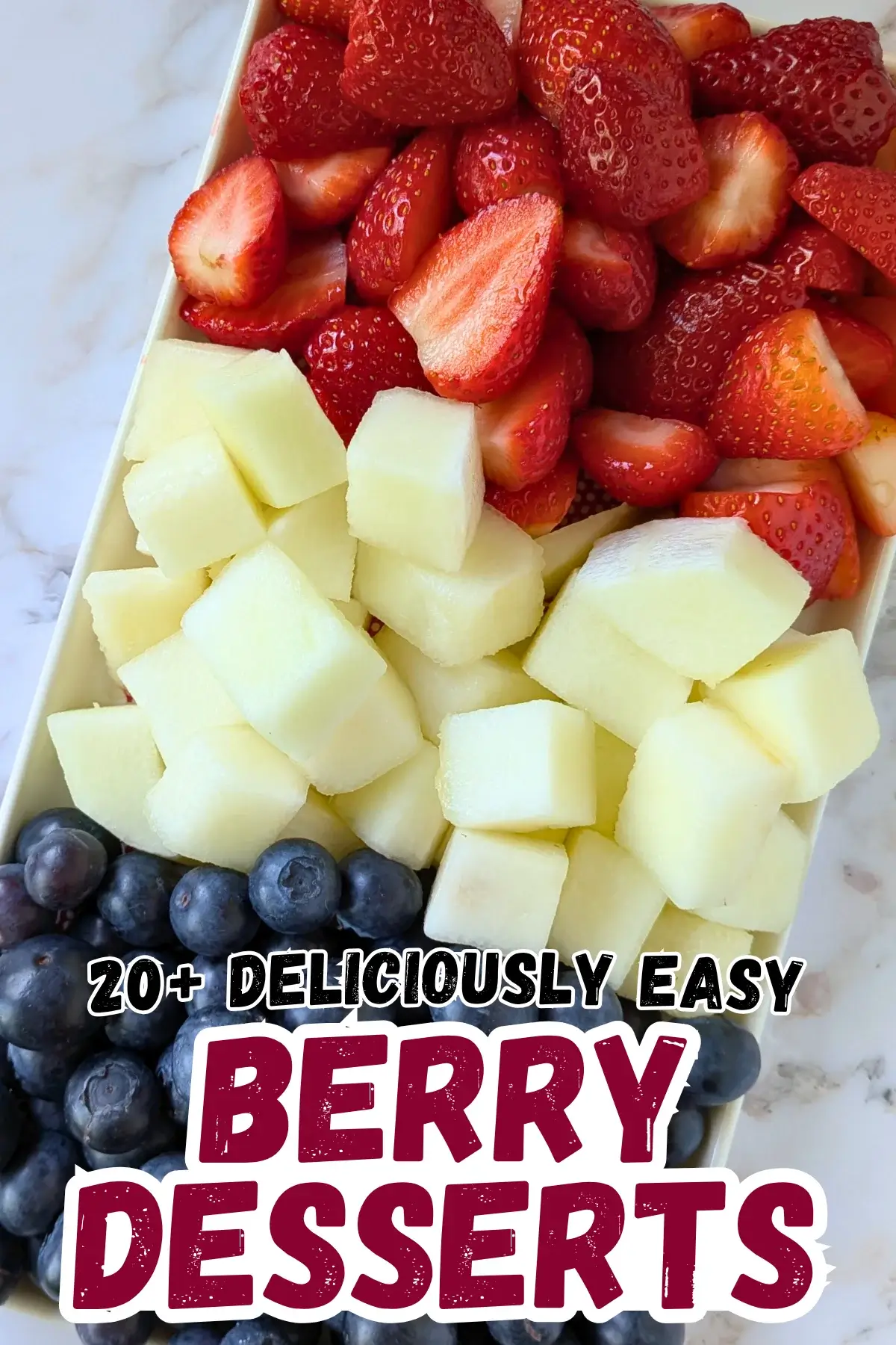 Red, White and Blue Fruit Tray - easy festive party fruit platter made with cut red strawberries, white honeydew melon, and blue blueberries for a red, white, and blue themed summer dessert or snack board.