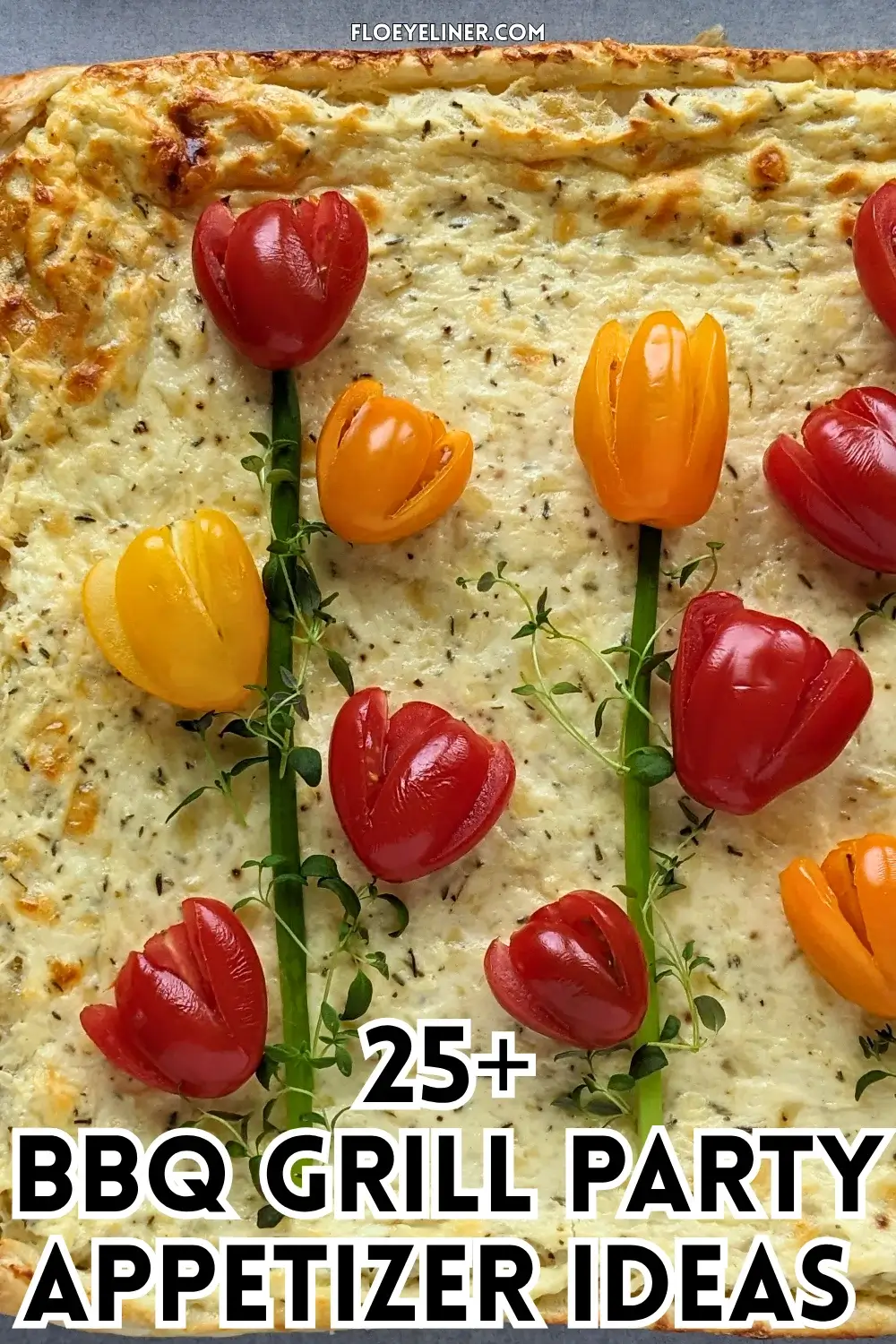 Savory Ricotta Puff Pastry Tart With Cherry Tomato Flowers - spring-themed puff pastry appetizer or dinner tart topped with a garlicky ricotta and grated Pecorino and cheese filling, topped with fresh red, orange, and yellow cherry tomatoes cut into shapes of tulips with green onions for stems and fresh thyme sprigs for leaves.