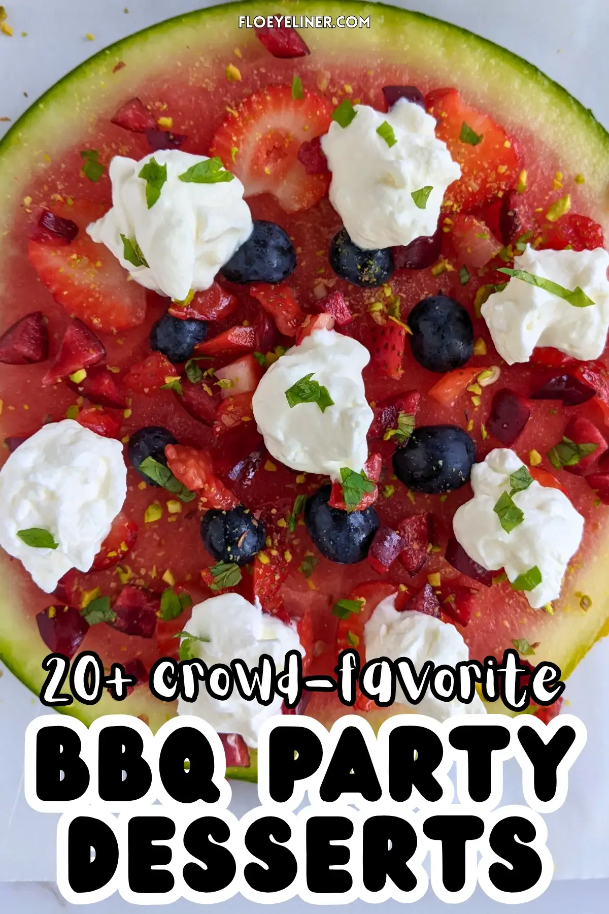 Watermelon Fruit Pizza With Berries and Whipped Cream - fruity dessert pizza on a base of a fresh watermelon slice, topped with blueberries, strawberries, cherries, dollops of whipped cream, and crushed pistachios.