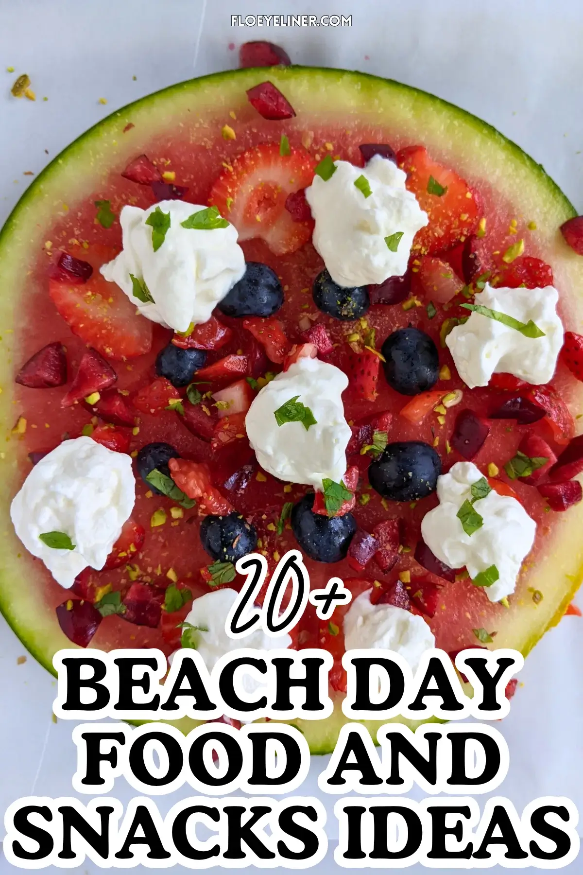 Watermelon Fruit Pizza With Berries and Whipped Cream - fruity dessert pizza on a base of a fresh watermelon slice, topped with blueberries, strawberries, cherries, dollops of whipped cream, and crushed pistachios.