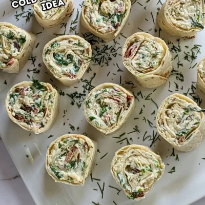 Crispy Ham and Double Cheese Tortilla Pinwheels - tortilla roll ups filled with a cream cheese, grated cheese, sour cream, garlicky crispy fried ham, shredded lettuce, and freshly chopped dill mix.