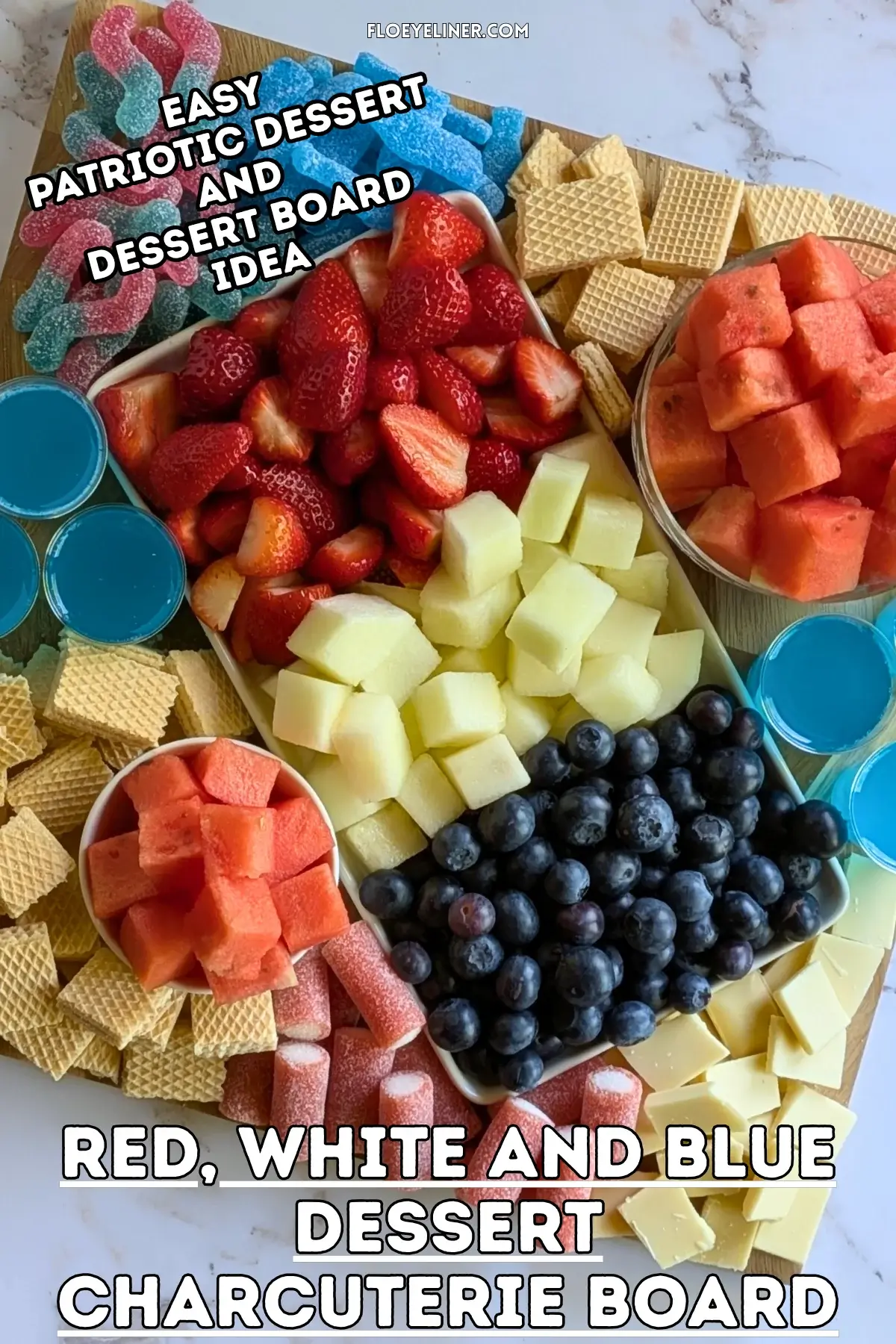 Red, White and Blue Dessert Charcuterie Board - festive red, white, and blue themed dessert tray made with fresh red strawberries and watermelon, plus red sour gummy candies; white honeydew melon, vanilla waffles, and white chocolate; and blue blueberries, blue sour gummy candies, and homemade alcohol-free blue Gatorade jello shots.
