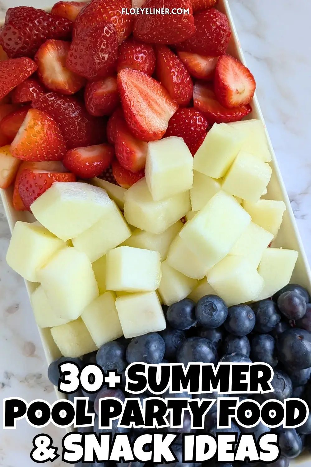 Red, White and Blue Fruit Tray - easy festive party fruit platter made with cut red strawberries, white honeydew melon, and blue blueberries for a red, white, and blue themed summer dessert or snack board.
